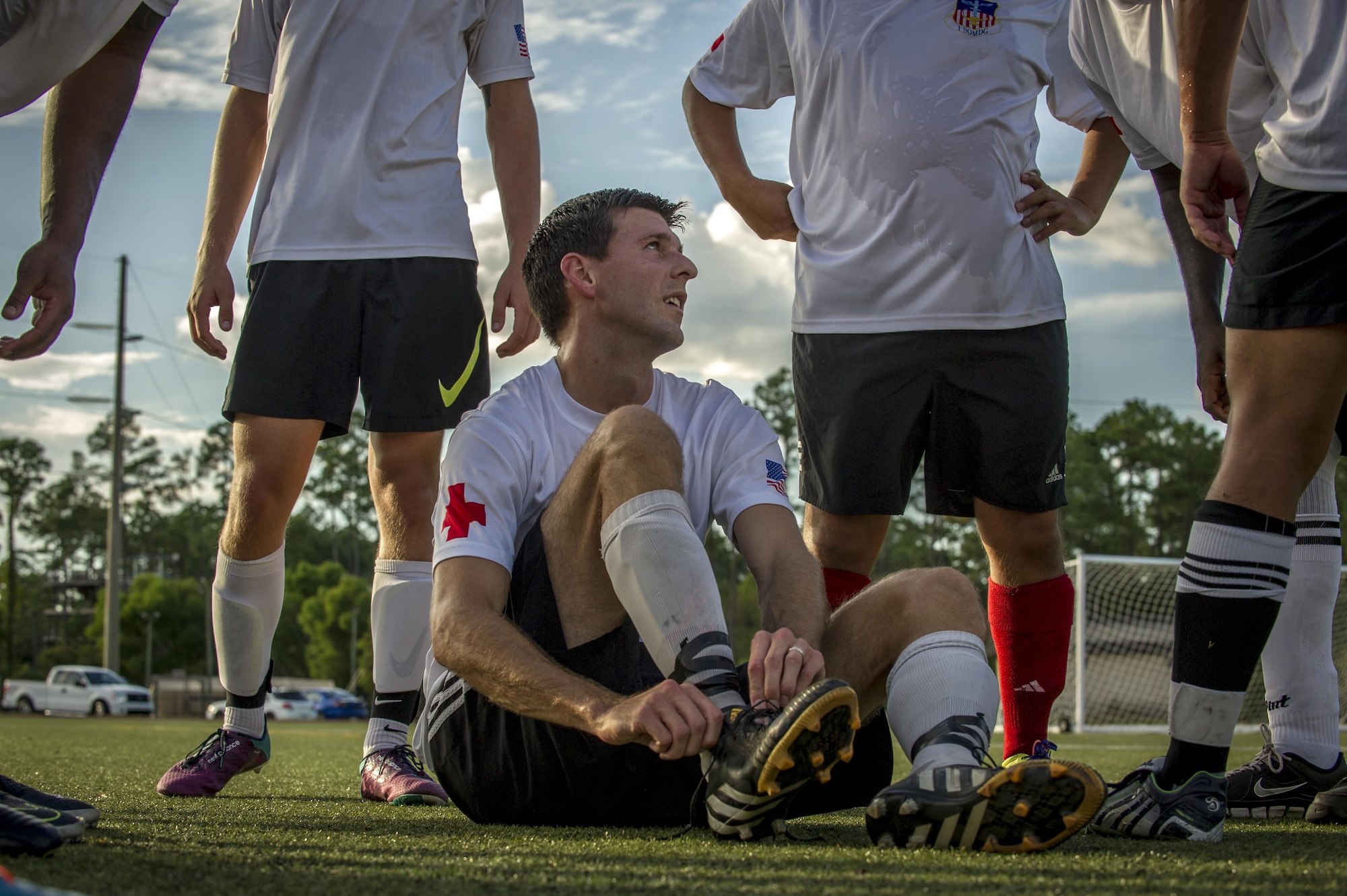 Alex Witmer, a member of the 1st Special Operations Medical Group intramural soccer team, speaks to his teammates at half time during the 2016 Intramural Soccer Championship game against the 319th Special Operations Squadron at Hurlburt Field, Fla. Sept. 13, 2016. The 1st SOMDG defeated the 319th SOS in a double-elimination match with a final score of 2-0. (U.S. Air Force photo by Airman 1st Class Isaac O. Guest IV)
