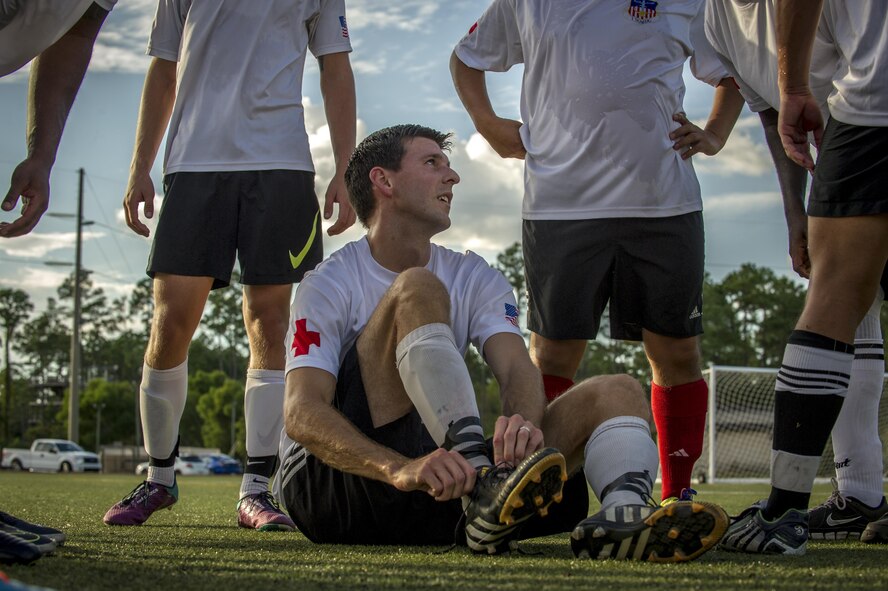 Alex Witmer, a member of the 1st Special Operations Medical Group intramural soccer team, speaks to his teammates at half time during the 2016 Intramural Soccer Championship game against the 319th Special Operations Squadron at Hurlburt Field, Fla. Sept. 13, 2016. The 1st SOMDG defeated the 319th SOS in a double-elimination match with a final score of 2-0. (U.S. Air Force photo by Airman 1st Class Isaac O. Guest IV)
