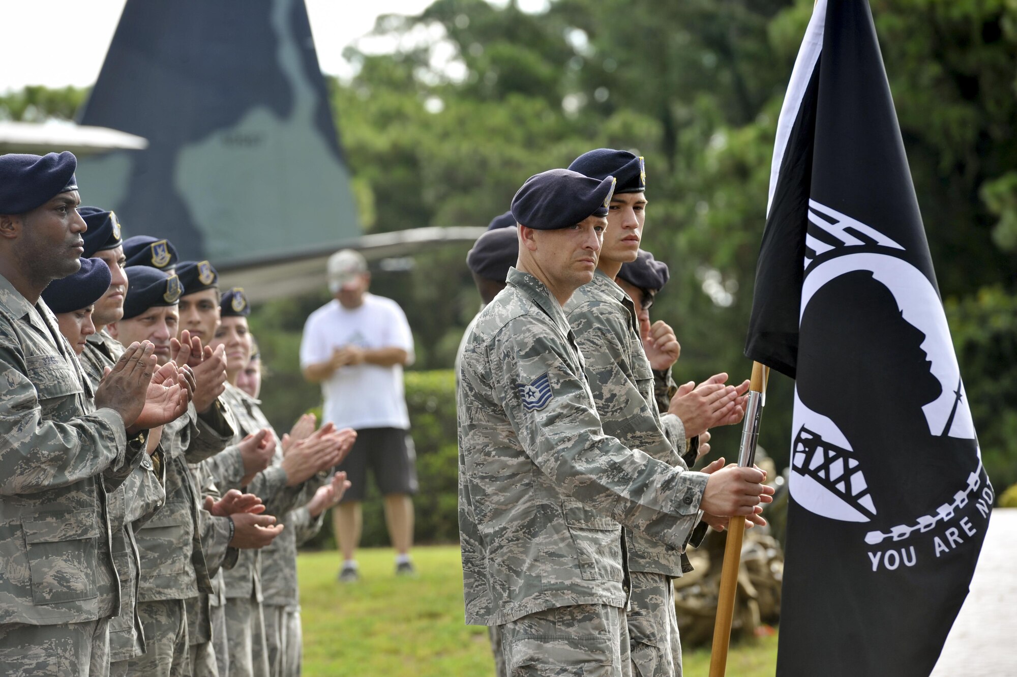 Defenders with the 1st Special Operations Security Forces Squadron applaud during a POW-MIA ceremony at the Air Park on Hurlburt Field, Fla., Sept. 16, 2016. A 24-hour ruck-vigil was performed in remembrance of prisoners of war and those identified as missing in action. (U.S. Air Force photo by Airman Dennis Spain)
