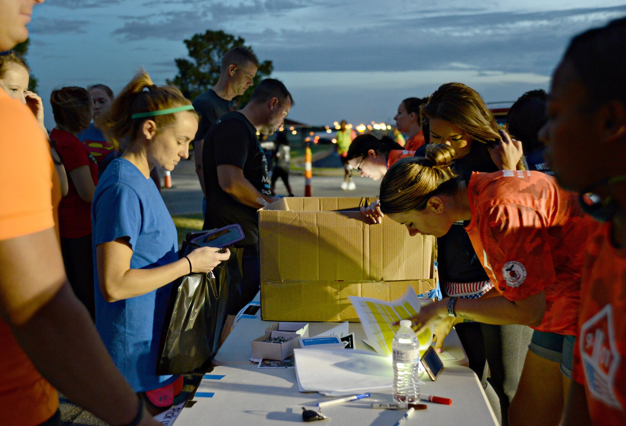 Participants arrived earlier than the 7 a.m. start time to register and receive their run packets at the 2nd Annual Run to Remember 9-11. The Sept. 9 event had almost 1,000 participants and volunteers. (Air Force photo by Kelly White)