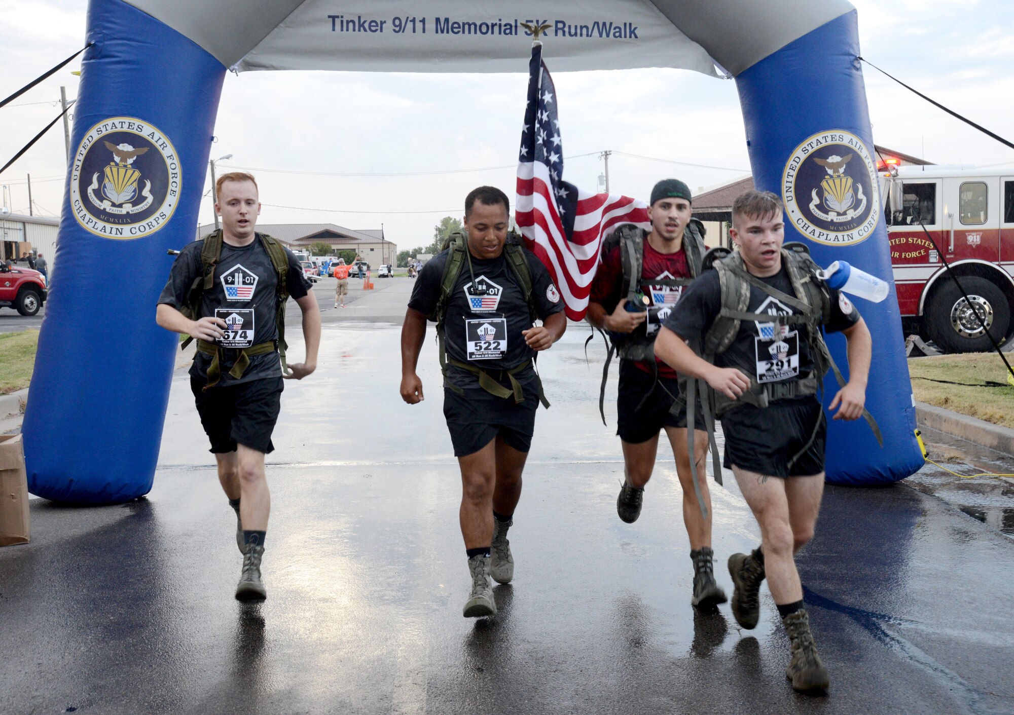 From left, Airman 1st Class Gilbert Devon, Airman 1st Class Toris Richardson, Airman 1st Class Maasry Ryan and Airman 1st Class David Sheppard, all with the 552nd Aircraft Maintenance Squadron, ran the 5K portion of the 2nd Annual Run to Remember 9-11 as a team. This year’s theme for 9-11 memorial events was “United, Remember, Defend”. (Air Force photo by Kelly White)
