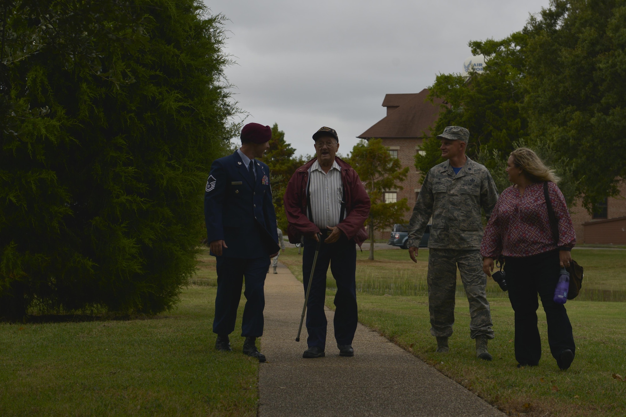 Allen Ordorff, center, a World War II veteran, makes his way to a POW/MIA Recognition Day ceremony at Joint Base Langley-Eustis, Va., Sept. 16, 2016. While attached to the 101st Airborne Division, Orndorff served in both the European and Pacific theater. (U.S. Air Force photo by Staff Sgt. Natasha Stannard)