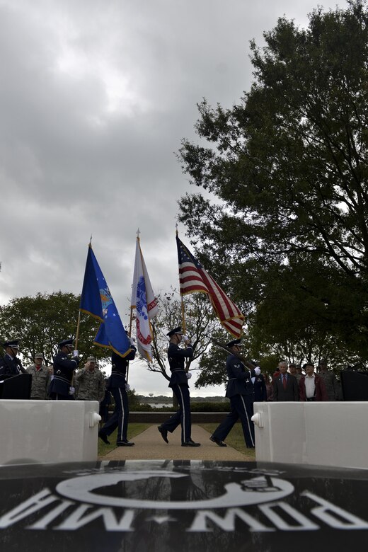 Members of the Joint Base Langley-Eustis honor guard prepare to post the colors during the POW/MIA Recognition Day ceremony at Joint Base Langley-Eustis, Va., Sept. 16, 2016. The flag is raised as a solemn reminder to never forget the sacrifices made to defend the Nation. (U.S. Air Force photo by Staff Sgt. Natasha Stannard)