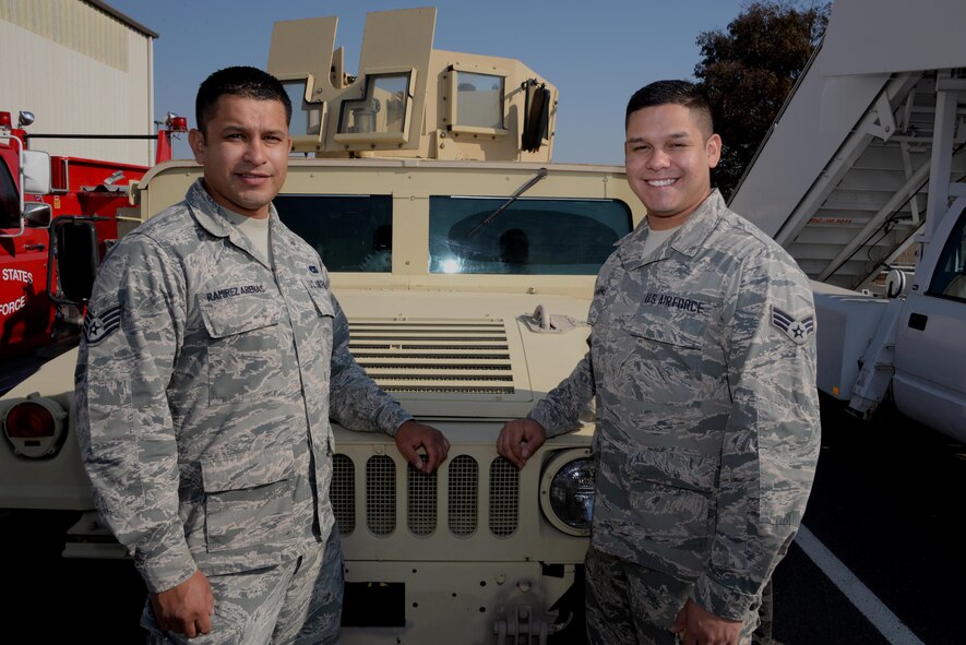 Staff Sgt. Angel Ramirez Arenas (Left), 60th Logistical Readiness Squadron NCO in charge of fleet management poses for a photo with his brother, Senior Airman Ramon Ramirez Arenas (Right), 60th Surgical Operations Squadron surgical technician, at Travis Air Force Base, Calif., Sept. 7, 2016. The brothers from Compton, Calif., have been assigned to TAFB for almost two years and have nearly a decade of military service between them. (U.S. Air Force photo by Tech. Sgt. James Hodgman)