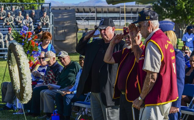 Former Prisoners of War salute the white wreath at the Prisoner of War/Missing in Action Ceremony at Freedom Park on Nellis Air Force Base, Nev., Sept. 16, 2016. Each year on the third Friday of September, the country honors our military members who have been or still are Prisoners of War or Missing in Action. There are currently more than 82,000 members of the military who are still missing from conflicts dating back to World War I. (U.S. Air Force photo by Airman 1st Class Nathan Byrnes)
