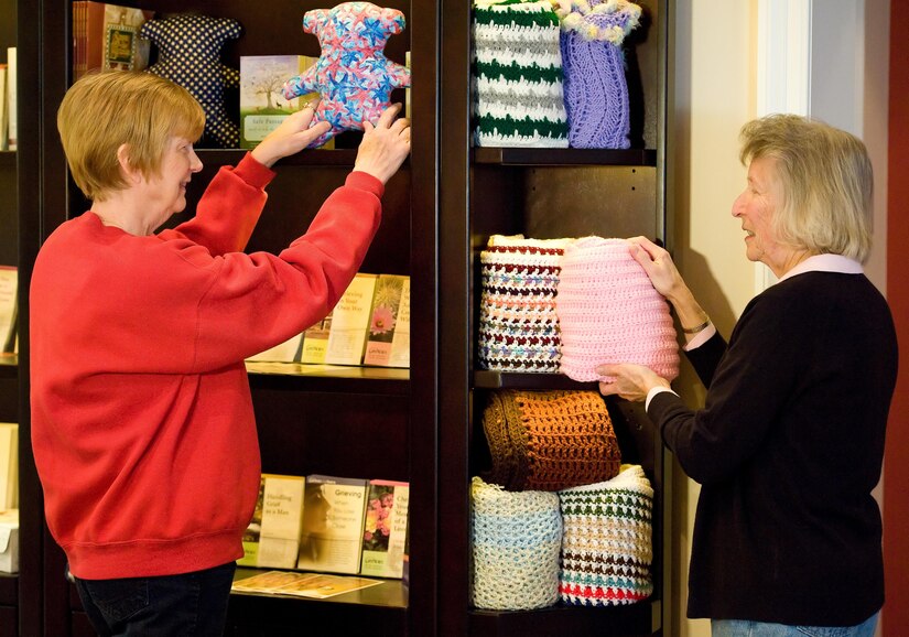 Janet King, Friends of the Fallen donation coordinator, and Ellie Dill, Friends of the Fallen volunteer replenish a teddy bear and comfort shawl at the Center for Families of the Fallen, Dover AFB, Delaware March 31, 2016. The shawls and bears are available at no cost for families traveling to Dover for a dignified transfer of a loved one through donations from across the nation to support families of the fallen. (U.S. Air Force photo/Roland Balik) 