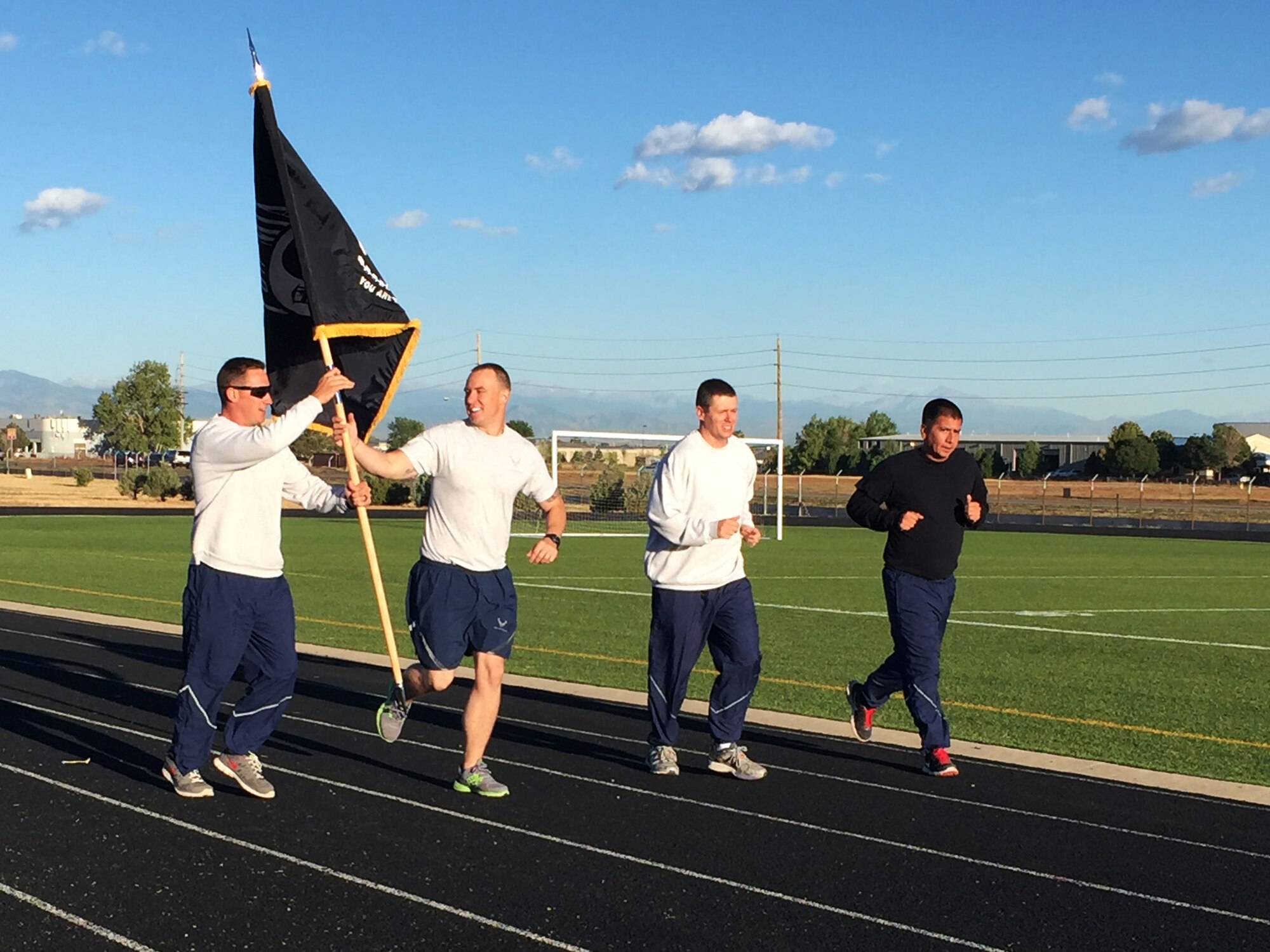 Members of Team Buckley participate in a 24-hour POW/MIA memorial run Sept. 15, 2016, at an outdoor track on Buckley Air Force Base, Colo. National POW/MIA Recognition Day is an annual event observed across the United States every third Friday of September. (U.S. Air Force photo by Airman 1st Class Gabrielle Spradling/Released)