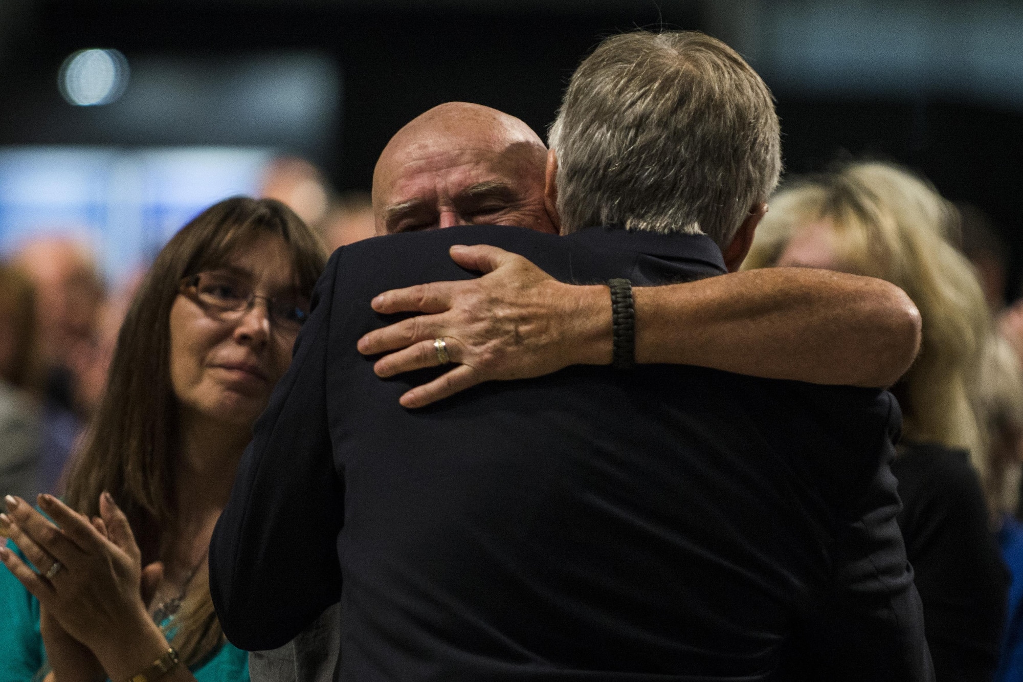 Veterans of the 20th Special Operations Squadron embrace each other during the Green Hornet Dedication ceremony at the National Museum of the United States Air Force near Wright-Patterson Air Force Base, Ohio, Sept. 15, 2016. According to the National Museum of the USAF historian Dr. Jeff Underwood, for many years, there wasn’t much information on the Green Hornets until recently due to the nature of their missions. (U.S. Air Force photo by Senior Airman Luke Kitterman/Released)