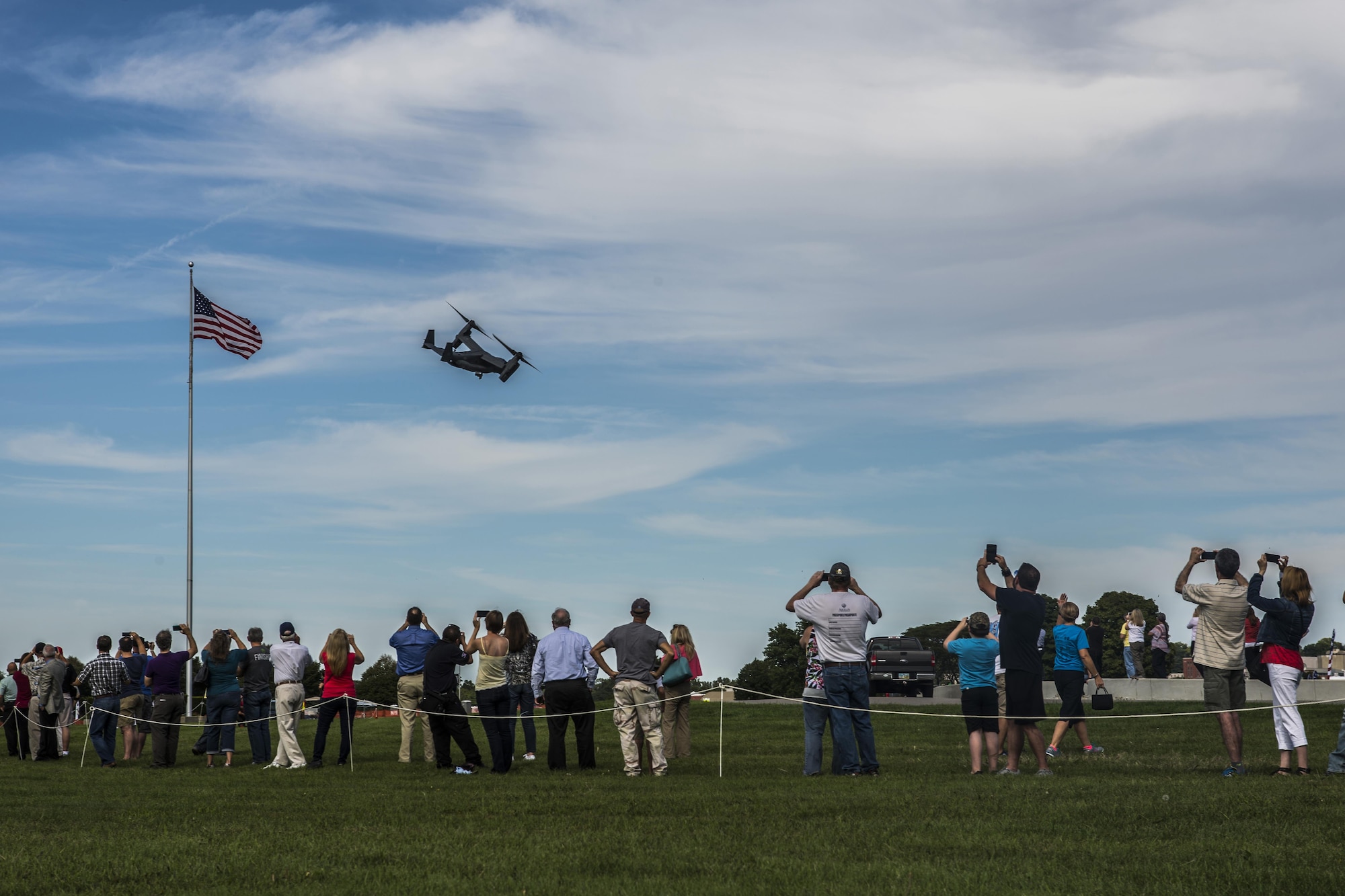 A CV-22 Osprey aircraft assigned to the 20th Special Operations Squadron at Cannon Air Force Base, N.M., provides a fly over for the public after the Green Hornet Dedication ceremony at the National Museum of the United States Air Force near Wright-Patterson Air Force Base, Ohio, Sept. 15, 2016. The aircraft landed at the museum in tribute to the Green Hornets. (U.S. Air Force photo by Senior Airman Luke Kitterman/Released)