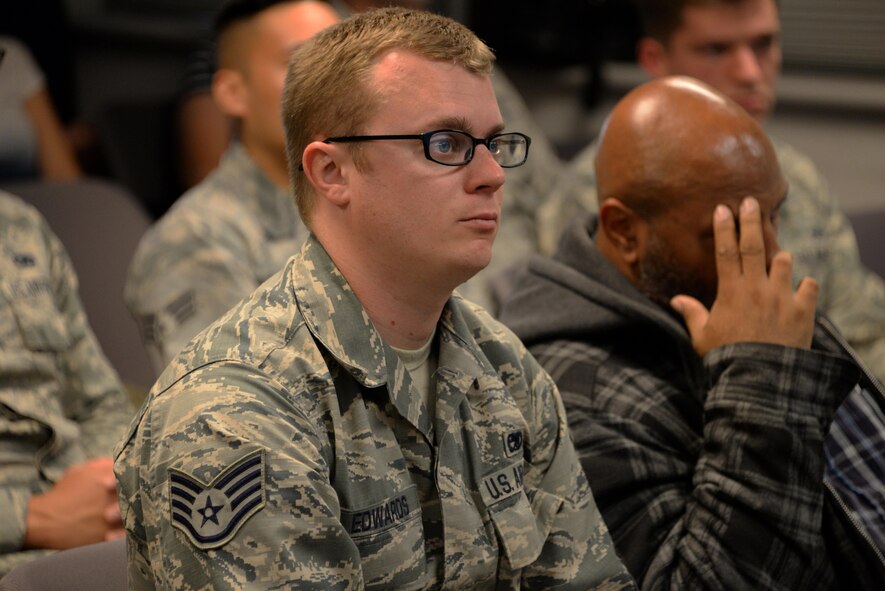 Staff Sgt. Matthew Edwards, 60th Maintenance Group C-5 electrical and environmental journeyman, listens to a Green Dot training presentation at Travis Air Force Base, Calif., Sept. 7, 2016. Green Dot training focuses on providing Airmen with tools to prevent power-based violence including sexual assault, domestic violence and bullying. Edwards said he will share what he learned in the course with his Airmen and hopes all Airmen will be proactive with preventing violence. (U.S. Air Force photo/Tech. Sgt. James Hodgman)