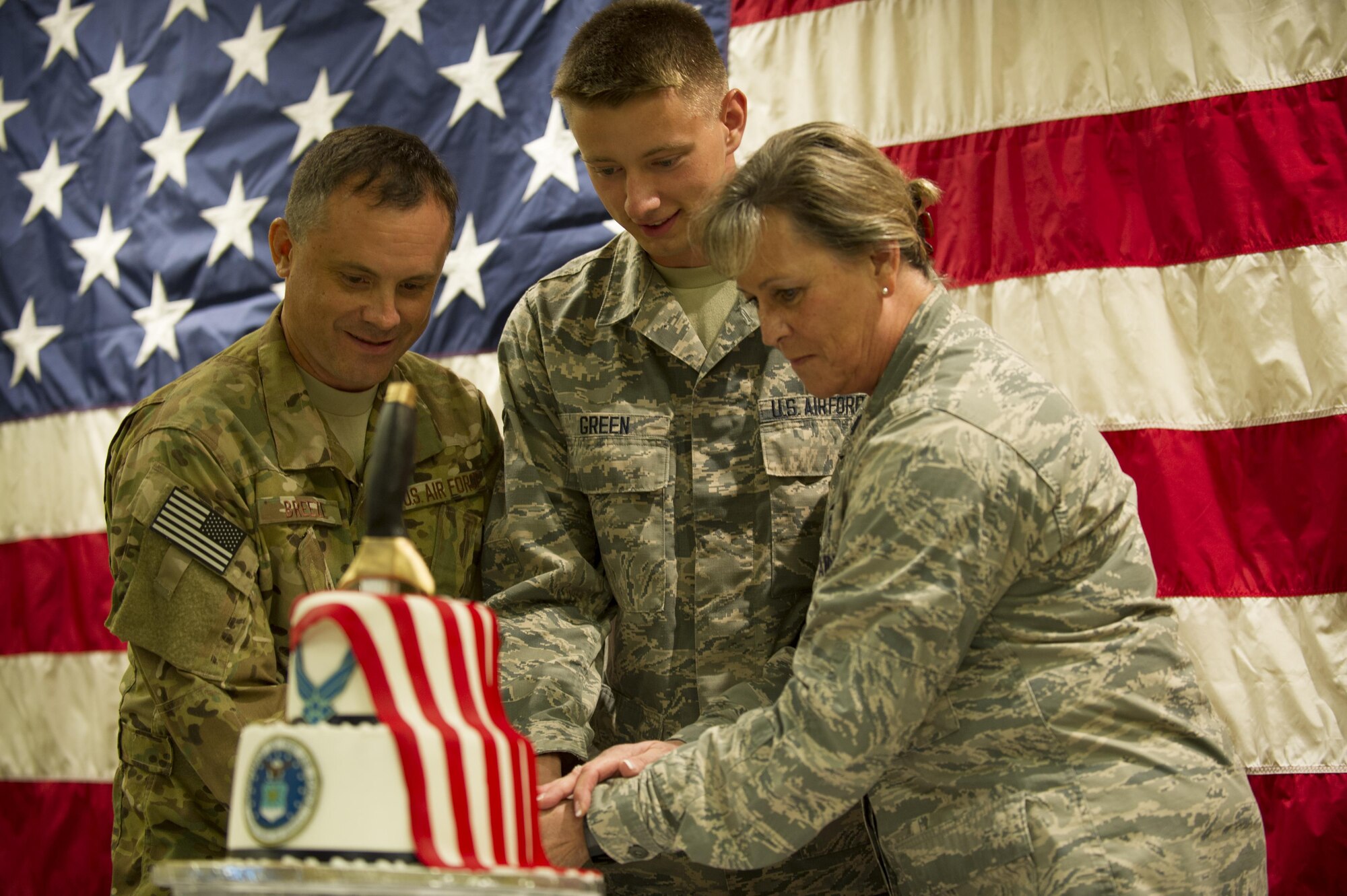 Col. Steven Breeze, vice commander of the 1st Special Operations Wing, and Airman 1st Class Wyatt Green, a vehicle operator with the 1st Special Operations Logistics Readiness Squadron, and Lt. Col. Deborah McCall, Health Care Intergrater with the 1st Special Operations Medical Group, cut a cake celebrating the Air Force’s 69th birthday at Hurlburt Field, Fla., Sept. 16, 2016.. The official birthday of the U.S. Air Force is Sept. 18, 1947. (U.S. Air Force photo by Airman 1st Class Isaac O. Guest IV)