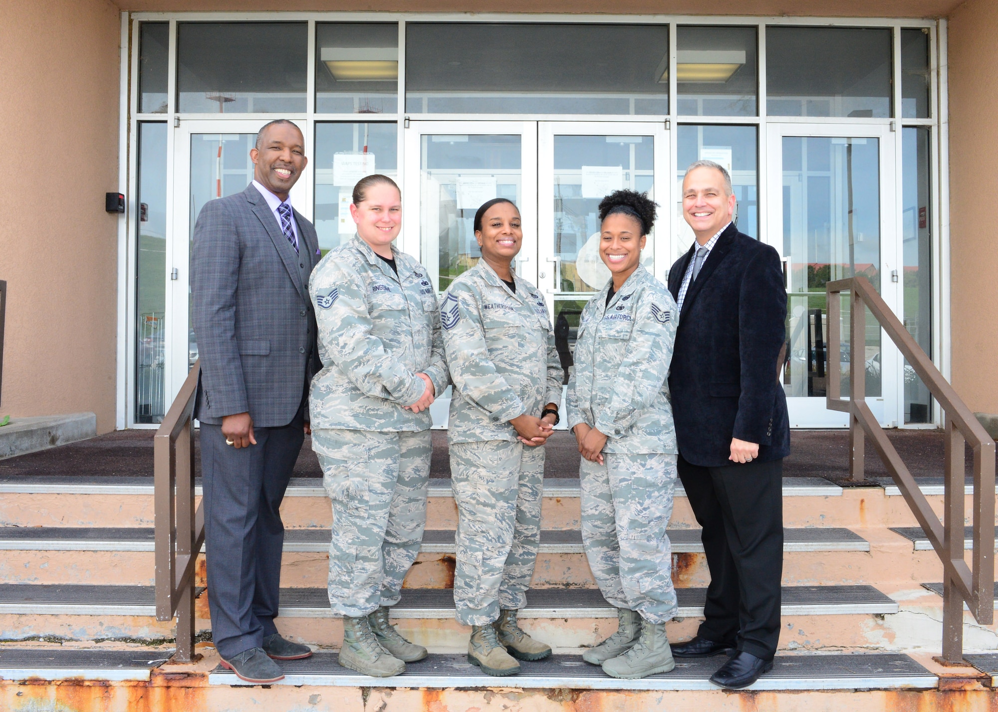 Members of the 55th Wing Equal Opportunity Office stand outside Building C at Offutt Air Force Base, Neb., Sept. 19, 2016. (U.S. Air Force photo by Senior Airman Rachel Hammes)
