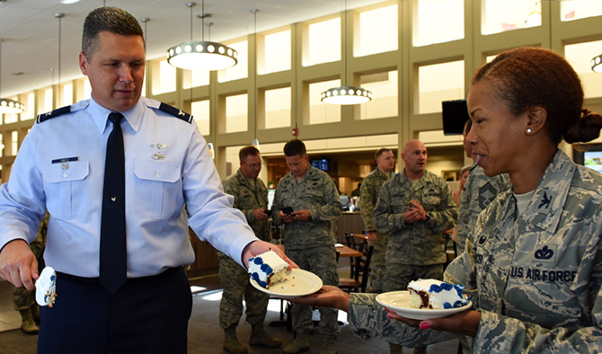 Col. Matthew Fritz, 92nd Air Refueling Wing vice commander, serves Col. Yvonne Spencer, 92nd Mission Support Group commander, a piece of birthday cake Sept. 13, 2016, at Fairchild Air Force Base. The cake was part of ceremony celebrating the United States Air Force's 69th Birthday. (U.S. Air Force photo/Airman 1st Class Ryan Lackey)