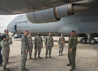 Master Sgt. Oscar Lamas, right, 356th Airlift Squadron load master, explains the lift capabilities of the C-5M Super Galaxy to Airmen of the 690th Network Support Squadron Sept. 13, 2016 at Joint Base San Antonio-Lackland, Texas. For many of the Airmen with the 690th NSS, this was their first time seeing the Air Force's largest cargo aircraft up close.  (U.S. Air Force photo/Benjamin Faske) 