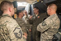 First Lt. David Fink, 68th Airlift Squadron C-5M Super Galaxy pilot, describes the amount of training it takes to be qualified to fly the massive cargo aircraft with Airmen of the 690th Network Support Squadron Sept. 13, 2016 at Joint Base San Antonio-Lackland, Texas. While Airmen of the 690th NSS are stationed at JBSA-Lackland alongside the 68th AS, this was the first time many of them have had the opportunity to see the Air Force's largest cargo aircraft up close.  (U.S. Air Force photo by Benjamin Faske)