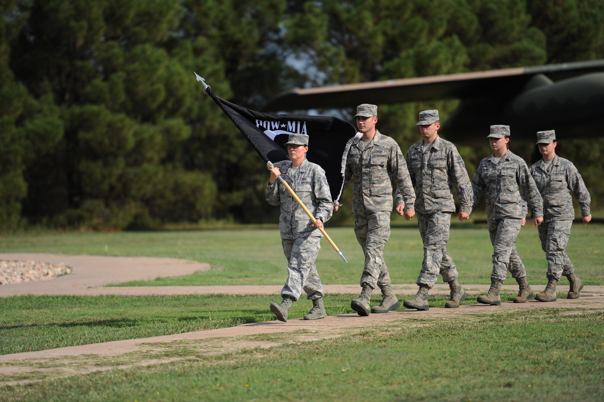 U.S. Air Force Airmen carry the prisoner-of-war/missing-in-action flag as part of the national POW/MIA recognition day, at Dyess Air Force Base, Texas, Sept. 16, 2016. The ceremony began at 7 a.m. and continued until the playing of retreat, a traditional call signifying the end of the day, at 5 p.m. (U.S. Air Force photo by Airman 1st Class Rebecca Van Syoc) 
