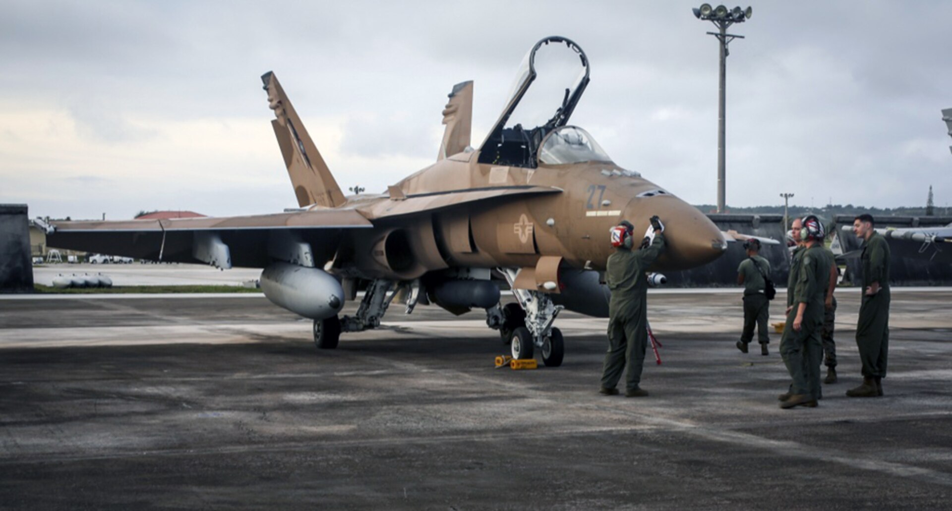 U.S. Marine Corps aviation maintenance personnel with Marine All Weather Fighter Attack Squadron 242, inspect an F/A-18D Hornet during Exercise Valiant Shield 16 at Andersen Air Force Base, Guam, Sept. 14, 2016. The inspection ensured there were no malfunctions with the aircraft while inflight. Valiant Shield is a biennial, U.S. Air Force, Navy, and Marine Corps exercise held in Guam, focusing on real-world proficiency in sustaining joint forces at sea, in the air, on land and in cyberspace.