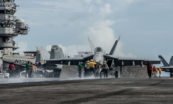 Sailors maneuver and prepare to launch an F/A-18E Super Hornet assigned to the "Dambusters" of Strike Fighter Squadron (VFA) 195 on the flight deck of the Navy's only forward-deployed aircraft carrier USS Ronald Reagan (CVN 76) during Valiant Shield 2016. USS Ronald Reagan is participating in Valiant Shield, a biennial, U.S. only, field-training exercise with a focus on integration of joint training among U.S. forces. This training enables real-world proficiency in sustaining joint forces through detecting, locating, tracking and engaging units at sea, in the air, on land and in cyberspace in response to a range of mission areas. 