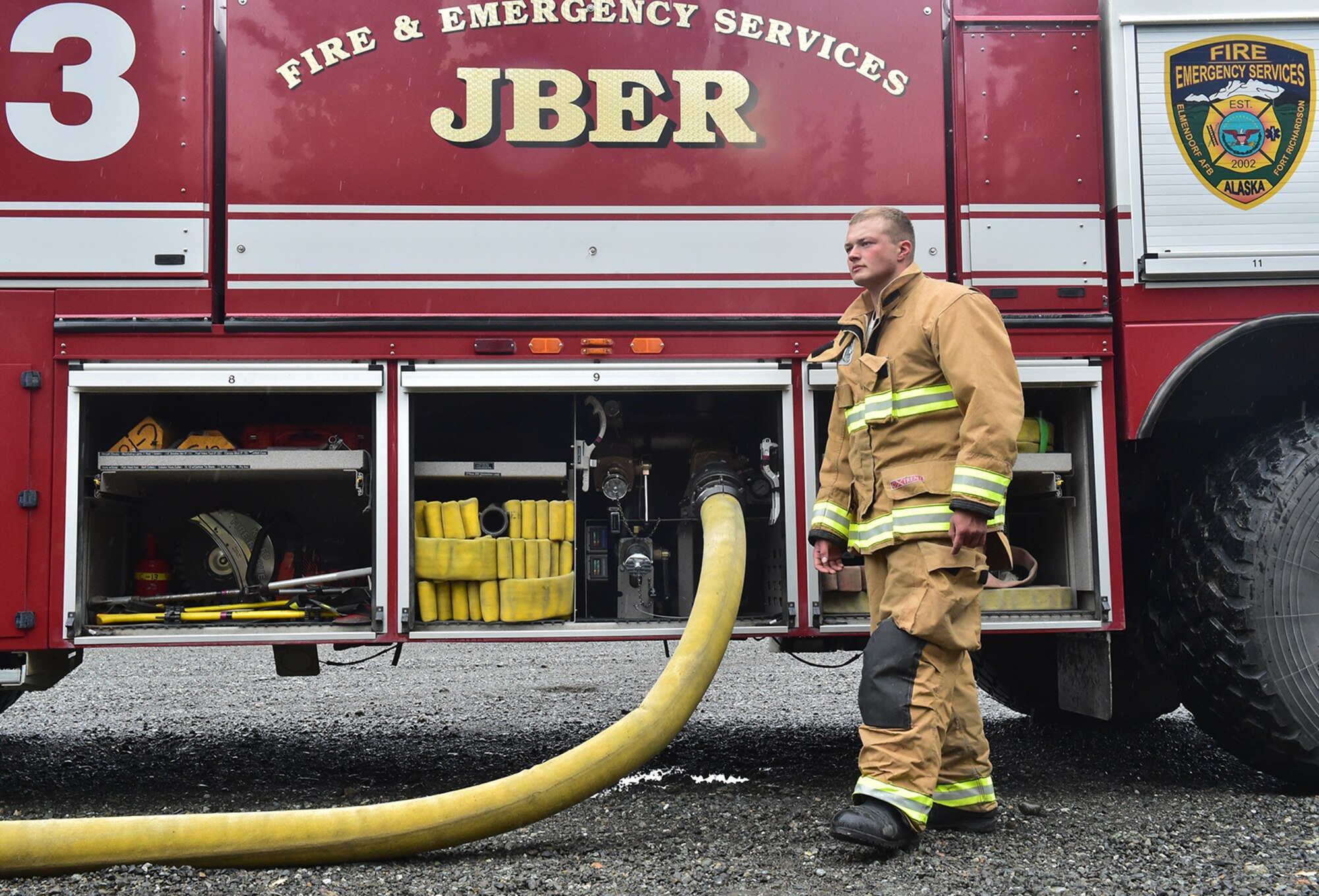Fire protection specialist Senior Airman Grant Kopplin, assigned to the 673rd Civil Engineer Squadron, perform firefighter training on a simulated aircraft fire at Joint Base Elmendorf-Richardson, Alaska, Wednesday, Sept. 14, 2016.  Aircraft live fire training is conducted periodically throughout the year at JBER to ensure Airmen are prepared to combat aircraft fuel fires.