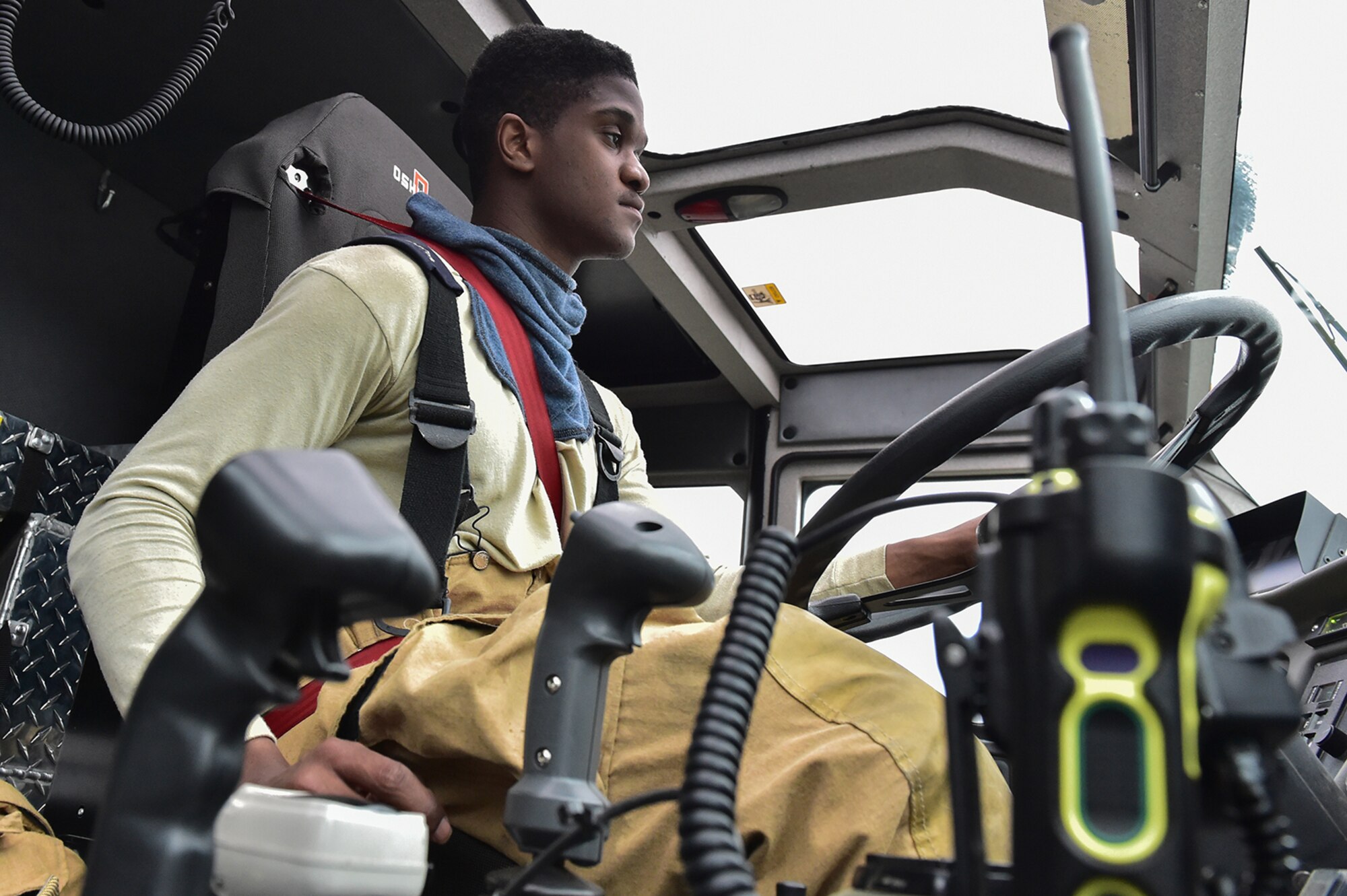 Fire protection specialist Senior Airman Larry Kyles, a native of Dallas, Texas, assigned to the 673rd Civil Engineer Squadron, drives a Striker vehicle during firefighter training on a simulated aircraft fire at Joint Base Elmendorf-Richardson, Alaska, Wednesday, Sept. 14, 2016.  Aircraft live fire training is conducted periodically throughout the year at JBER to ensure Airmen are prepared to combat aircraft fuel fires.