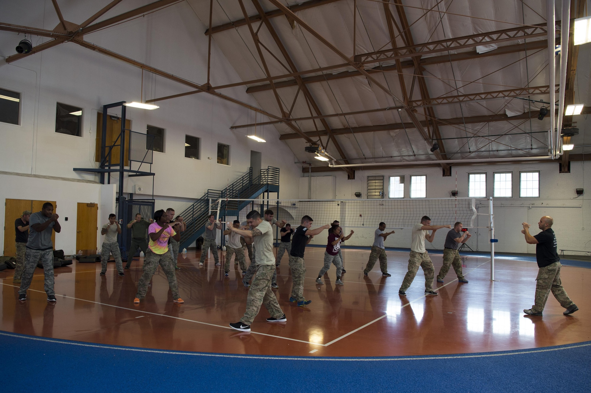 Twentieth Air Force security forces members warm up during a Krav Maga certification course at F.E. Warren Air Force Base, Sept. 14, 2016. This was the first time the week-long course was offered to defenders in 20th AF. The certification allows these Airmen to share the self-defense training with their respective units. The 20th AF ICBM Center of Excellence offers multiple training and professional development courses throughout the year for all Airmen, regardless of rank or Air Force specialty code. (U.S. Air Force photo by Staff Sgt. Christopher Ruano)