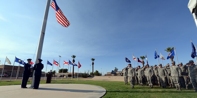 The American flag is lowered toward the end of the National POW/MIA Recognition Day vigil Sept. 16, 2016 at Luke Air Force Base, Ariz. The ceremony consisted of guest speakers and members of the 56th Fighter Wing honoring service members who are missing in action or are or were prisoners of war. (U.S. Air Force photo by Senior Airman Devante Williams)
