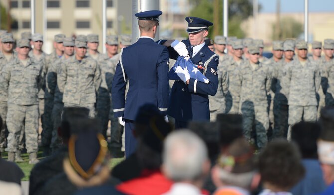 The 56th Force Support Squadron honor guard perform the flag folding ceremony during the National POW/MIA Recognition Day vigil Sept. 16, 2016 at Luke Air Force Base, Ariz. The ceremony consisted of honoring service members who are missing in action or are or were prisoners of war. (U.S. Air Force photo by Senior Airman James Hensley)