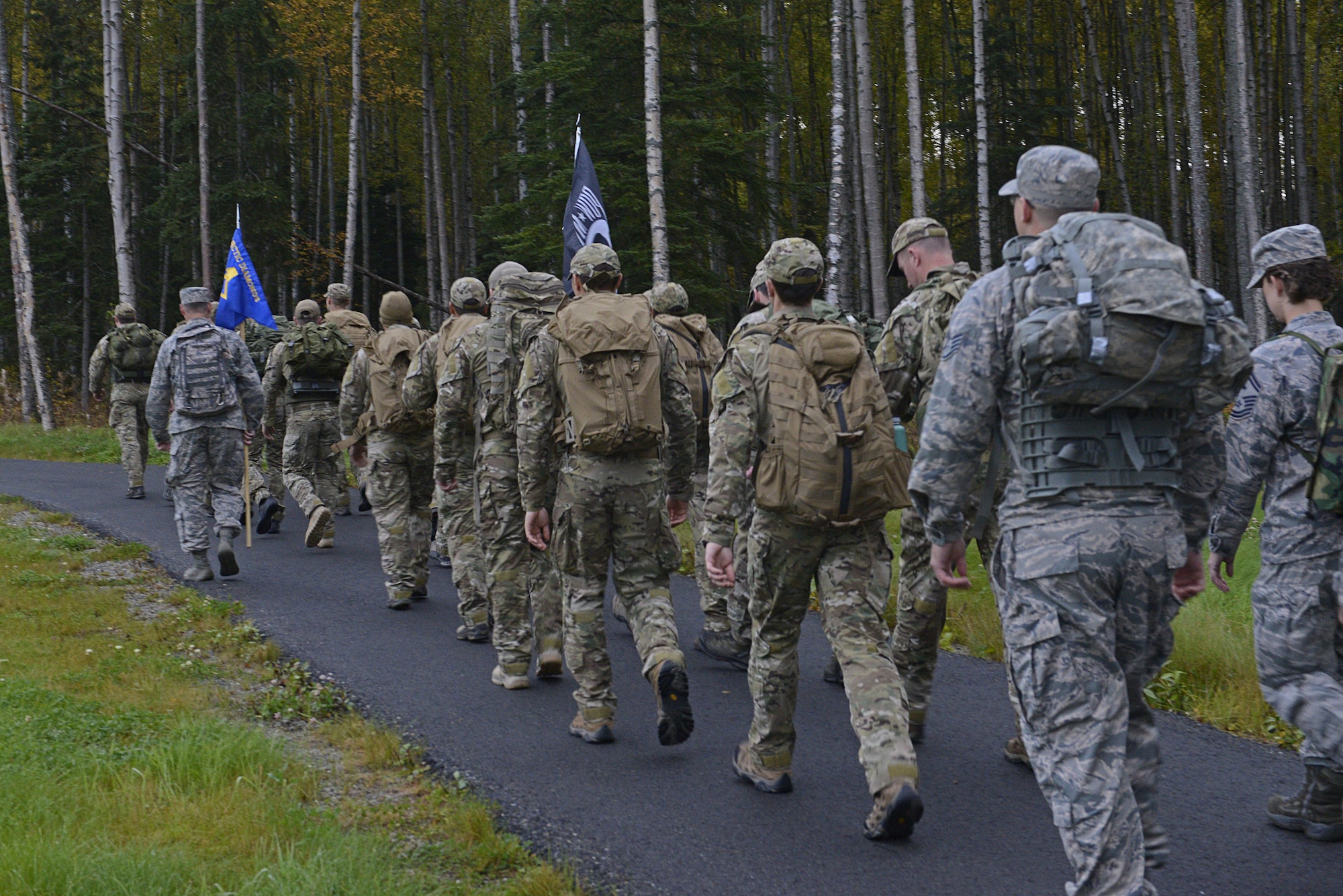 The 673d Medical Group hosted a POW/MIA ruck march at Joint Base Elmendorf-Richardson, Alaska, Sept. 16, 2016. More than 200 personnel including Airmen, Soldiers and Royal Canadian Air Force members, marched a total of five miles carrying 20 lbs. of canned food to deliver and donate to the Alaska Fisher House.