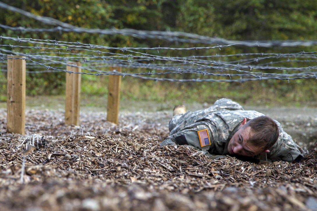 Army National Guard Spc. Zachary White competes in an obstacle course event during the Best Warrior Competition at Camp Carroll, Joint Base Elmendorf-Richardson, Alaska, Sept. 8, 2016. Winners of the competition move on to compete in the National Guard’s regional Best Warrior Competition. Army National Guard photo by Officer Candidate Marisa Lindsay