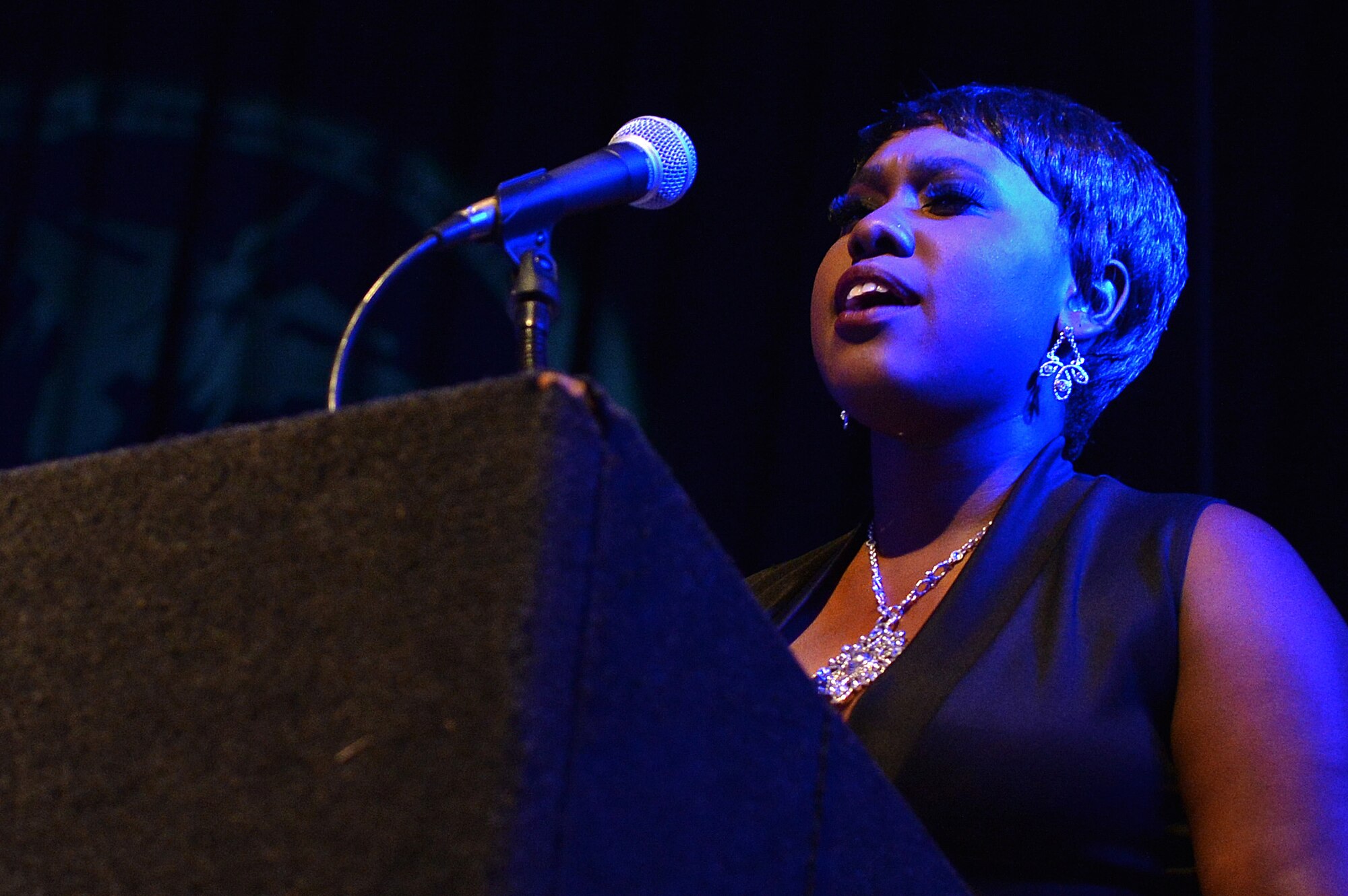 Mrs. Kierra Rawls sings the national anthem during the Air Force Ball at the Sumter Civic Center, Sumter, S.C., Sept. 16, 2016. In addition to celebrating the Air Force’s 69th birthday, S.C. Gov. Nikki Haley declared Sept. 16, 2016, “Shaw Air Force Base Day” to celebrate the 75th Anniversary of Shaw AFB. (U.S. Air Force photo by Airman 1st Class Christopher Maldonado)