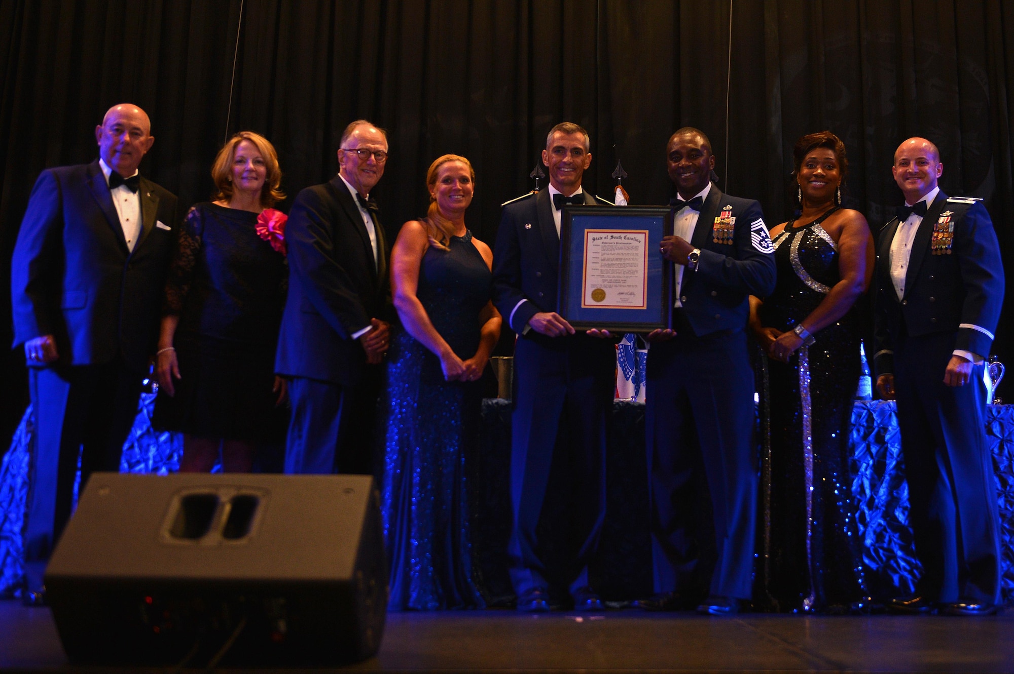 Retired Gen. T. Michael Moseley, previous 19th Air Force chief of staff and guest speaker for the Air Force Ball, stands with team Shaw leadership and Joseph McElveen, mayor of Sumter, at the Sumter Civic Center, Sumter, S.C., Sept. 16, 2016. Moseley spoke to guests about the history of the Air Force and expressed his gratitude for those in attendance. (U.S. Air Force photo by Airman 1st Class Christopher Maldonado)