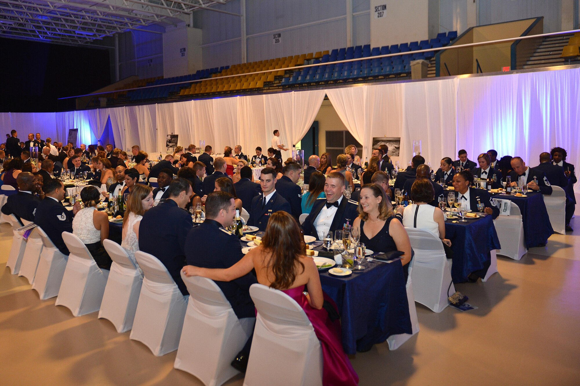 Team Shaw and Sumter community members eat dinner during the Air Force Ball at the Sumter Civic Center, Sumter, S.C., Sept. 16, 2016. The event was open to the public as a way of celebrating the community partnership with Shaw Air Force Base. (U.S. Air Force photo by Airman 1st Class Christopher Maldonado) 
