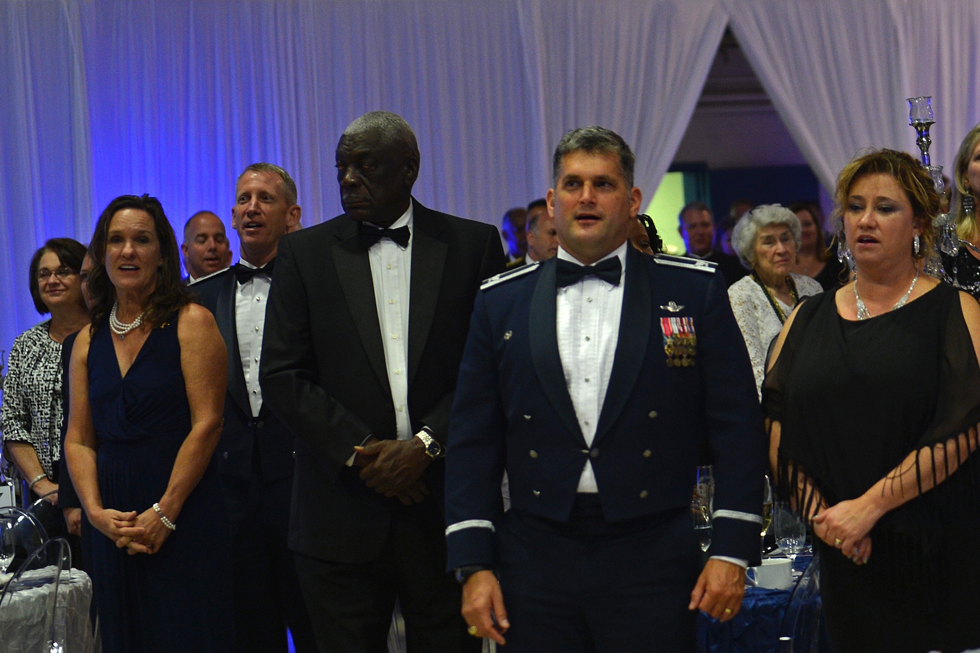 Members of Team Shaw and the Sumter community sing the Air Force Song during the Air Force Ball at the Sumter Civic Center, Sumter, S.C., Sept. 16, 2016. This year’s Air Force Ball celebrates both the 69th birthday of the Air Force and the 75th Anniversary of Shaw Air Force Base, S.C. (U.S. Air Force photo by Airman 1st Class Christopher Maldonado)