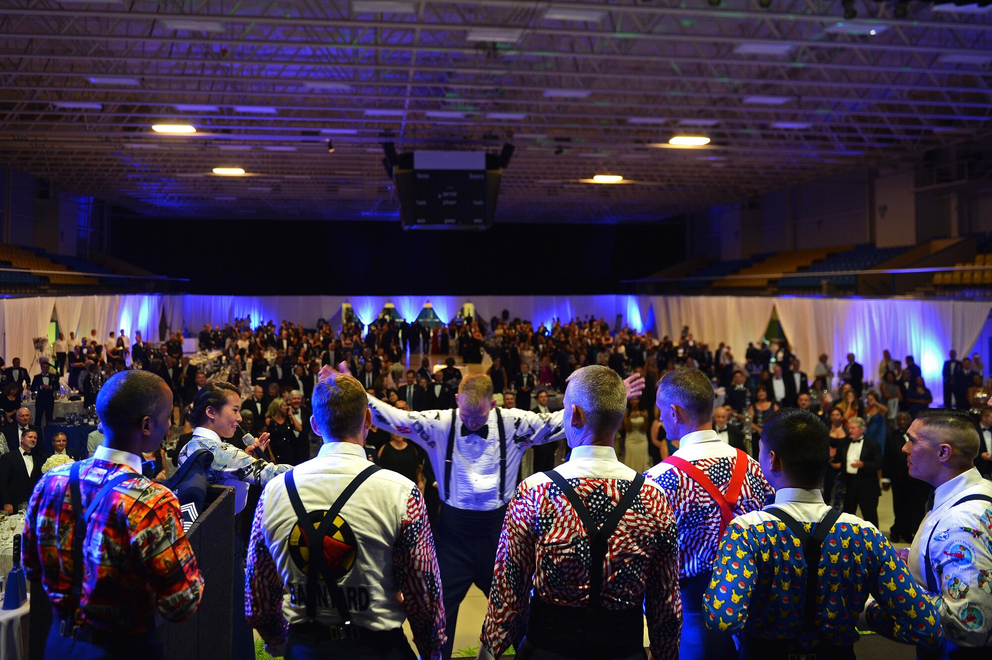 Guest participate in a party shirt dance contest during the Air Force Ball at the Sumter Civic Center, Sumter, S.C., Sept. 16, 2016. Contestants were judged based off audience applause and the winners were announced as king or queen of the ball. (U.S. Air Force photo by Airman 1st Class Christopher Maldonado)  