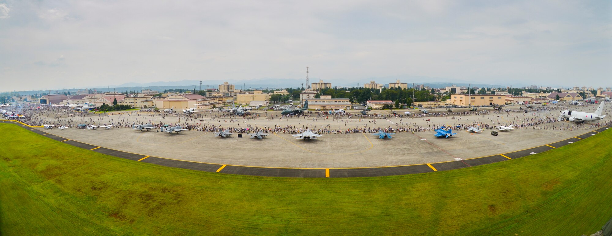 The 36th Airlift Squadron demonstrates a low-cost, low-altitude cargo drop on the air field during the 2016 Japanese-American Friendship Festival at Yokota Air Base, Japan, Sept. 17, 2016. The festival hosted food vendors, static aircraft displays, live entertainment and military and government demonstrations.  (U.S. Air Force photo by Airman 1st Class Elizabeth Baker/Released)