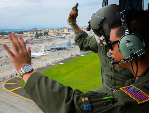The 36th Airlift Squadron demonstrates a low-cost, low-altitude cargo drop on the air field during the 2016 Japanese-American Friendship Festival at Yokota Air Base, Japan, Sept. 17, 2016. The festival hosted food vendors, static aircraft displays, live entertainment and military and government demonstrations.  (U.S. Air Force photo by Airman 1st Class Elizabeth Baker/Released)