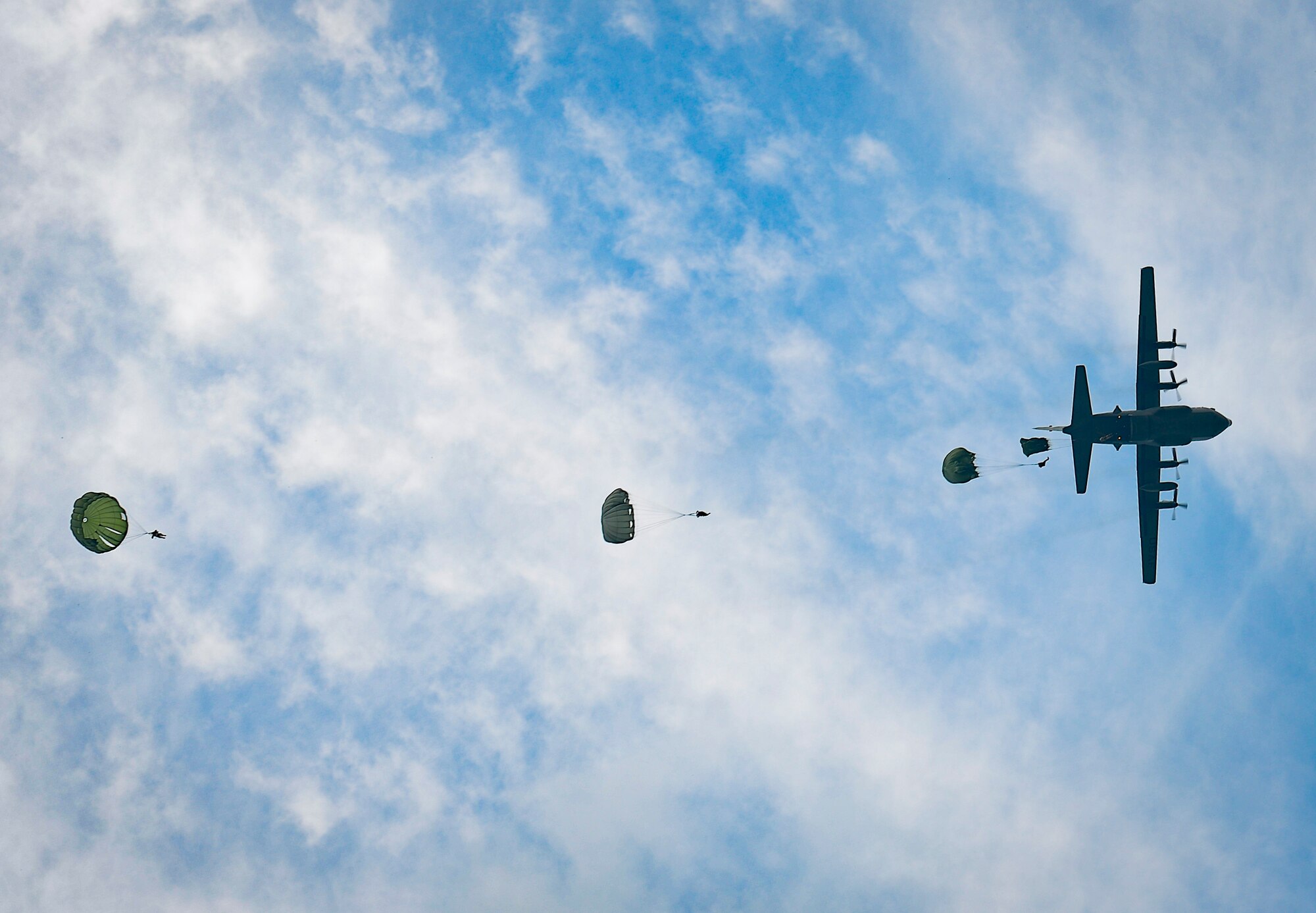 The 36th Airlift Squadron demonstrates a low-cost, low-altitude cargo drop on the air field during the 2016 Japanese-American Friendship Festival at Yokota Air Base, Japan, Sept. 17, 2016. The festival hosted food vendors, static aircraft displays, live entertainment and military and government demonstrations.  (U.S. Air Force photo by Airman 1st Class Elizabeth Baker/Released)