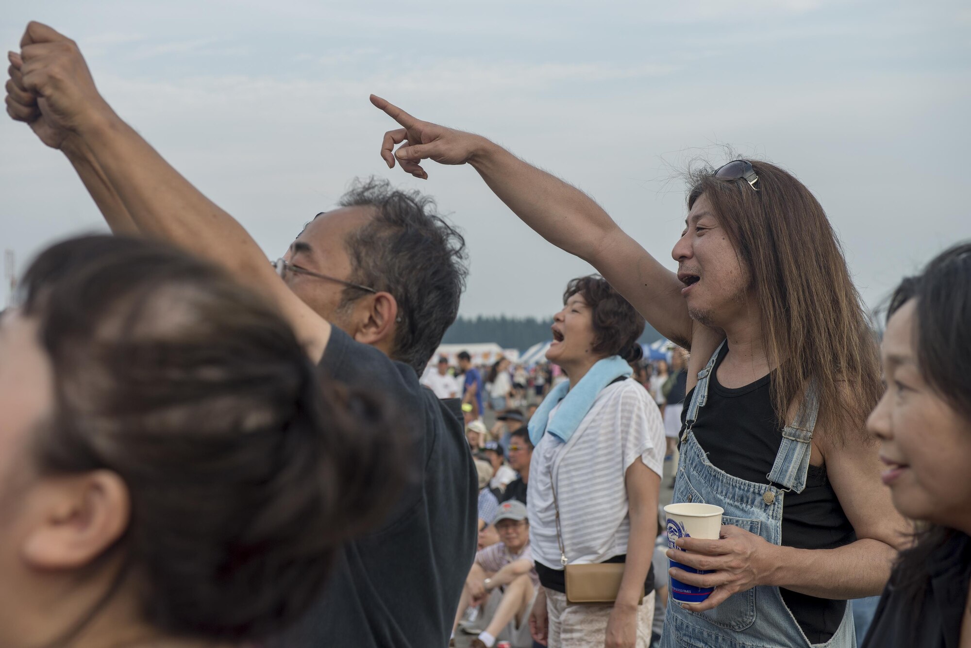 2016 Friendship Festival attendees rock out at Yokota Air Base, Japan, Sept. 17, 2016. The festival included more than 15 musical performances across two stages. (U.S. Air Force photo by Senior Airman David C. Danford/Released)