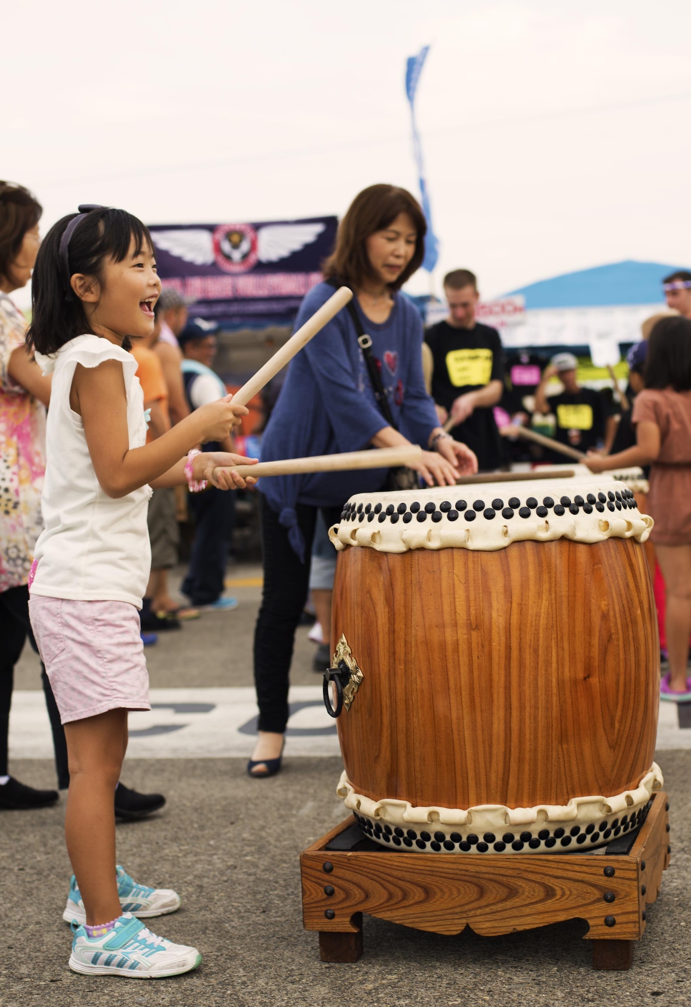 A young girl plays the drums at the Friendship Festival on 17 Sept. 2016, at Yokota Air Base, Japan. The Friendship Festival is an annual event where over 100,000 members of the local community come to see the base. (U.S. Air Force photo by Airman 1st Class Donald Hudson/Released)
