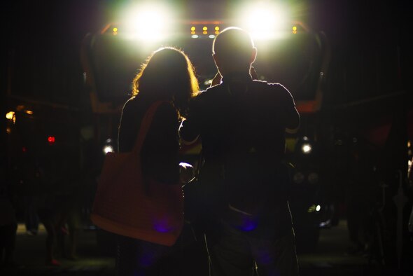 A couple takes photos of a fire truck at the Friendship Festival 17 Sept. 2016, at Yokota Air Base, Japan. The festival had various static displays of vehicle and airplanes for attendees to explore. (U.S. Air Force photo by Airman 1st Class Donald Hudson/Released)