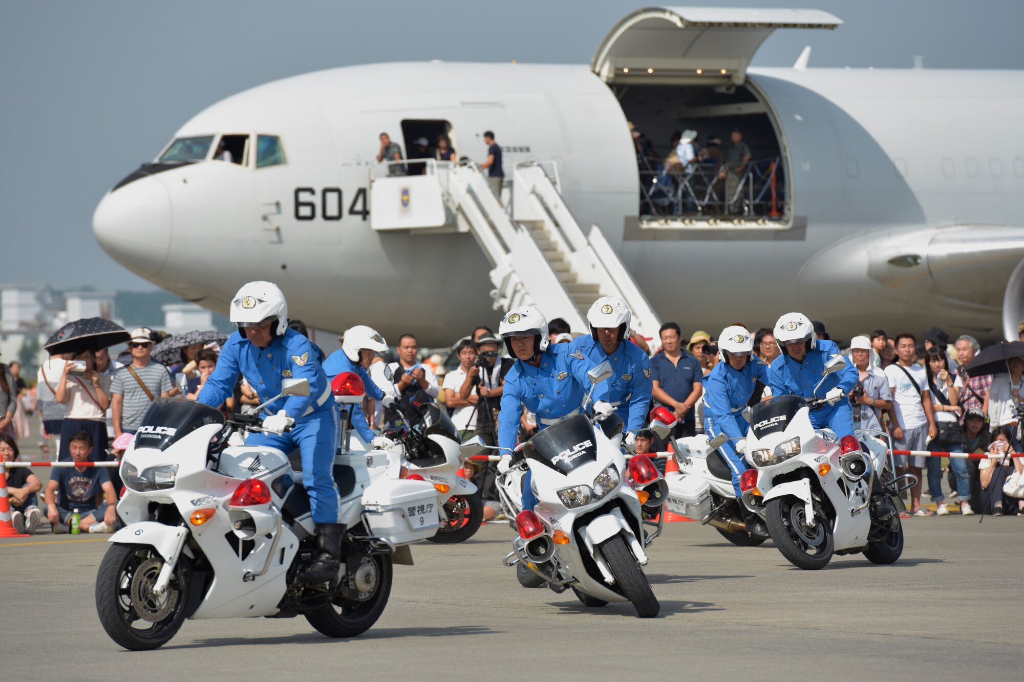 Members of the Tokyo Metropolitan Police Department 9th district traffic mobile unit conduct their motorcycle demonstration during the 2016 Friendship Festival at Yokota Air Base, Japan, Sept. 17, 2016. The festival hosted food vendors, static aircraft displays, live entertainment and military and government demonstrations. (U.S. Air Force photo by Machiko Imai/Released)