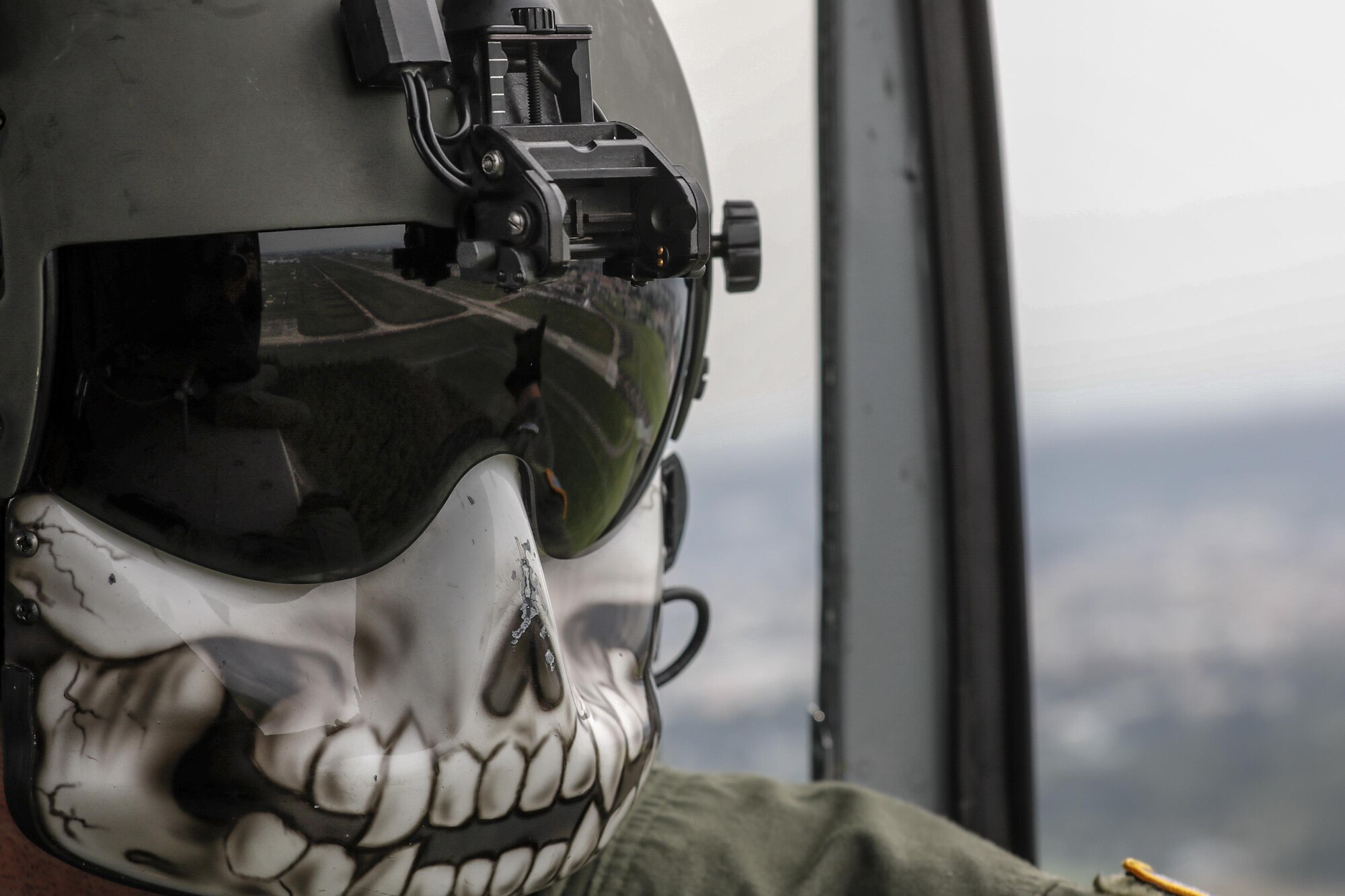 Tech. Sgt. Christopher Rector, 459th Airlift Squadron special mission aviator, performs visual conformation during the 2016 Friendship Festival at Yokota Air Base, Japan, Sept. 17, 2016. The 459th Airlift Squadron demonstrated their airlift capabilities to a crowd of tens of thousands. (U.S. Air Force photo by Yasuo Osakabe/Released) 