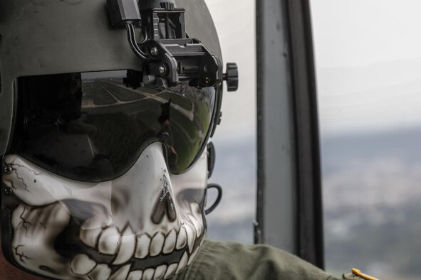 Tech. Sgt. Christopher Rector, 459th Airlift Squadron special mission aviator, performs visual conformation during the 2016 Friendship Festival at Yokota Air Base, Japan, Sept. 17, 2016. The 459th Airlift Squadron demonstrated their airlift capabilities to a crowd of tens of thousands. (U.S. Air Force photo by Yasuo Osakabe/Released) 