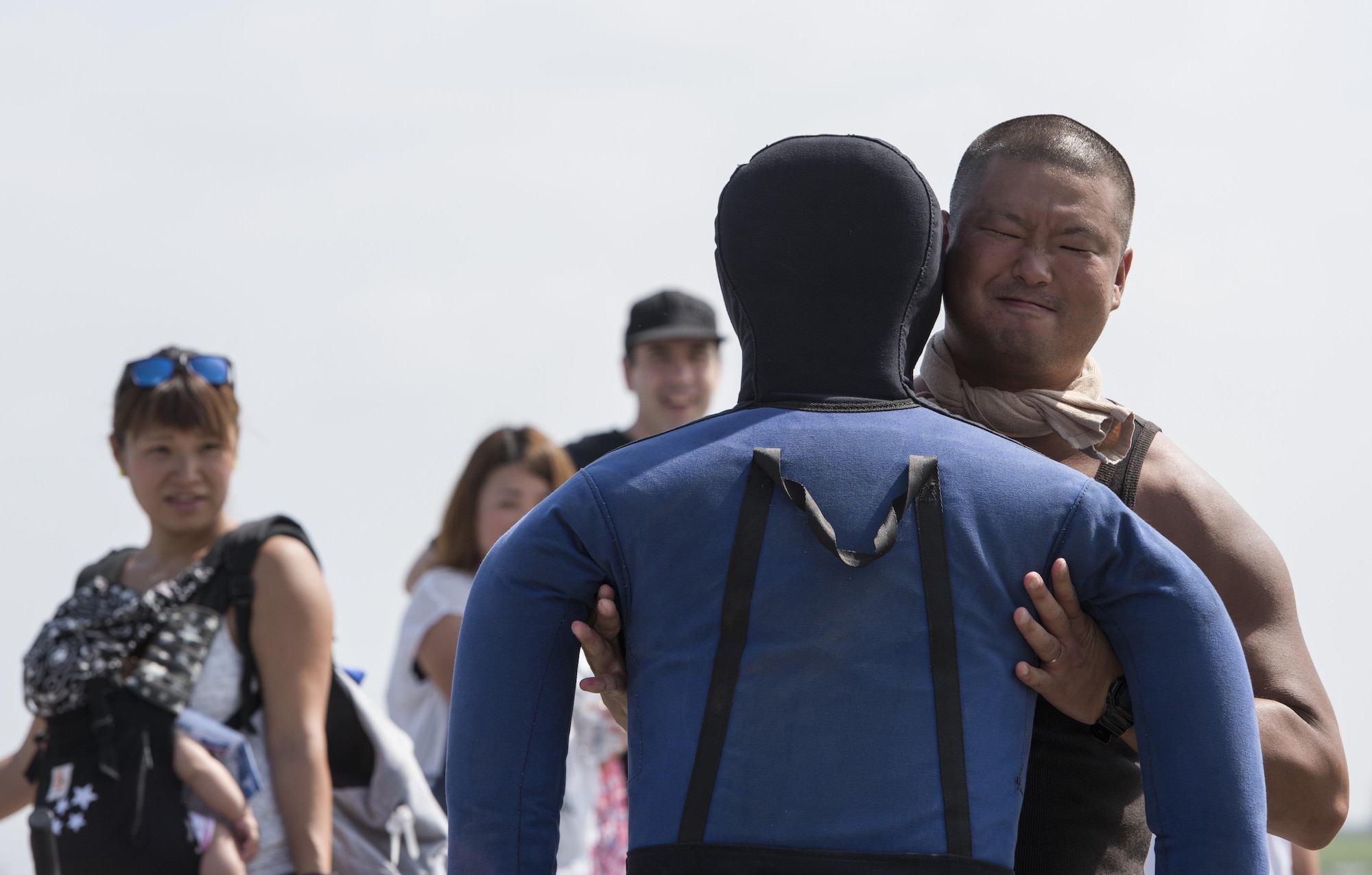 A festivalgoer lifts a weighted dummy at the 374th Civil Engineer fire protection display during the 2016 Japanese-American Friendship Festival at Yokota Air Base, Japan, Sept. 17, 2016. Fire fighters at Yokota use the dummy to practice carries that could potentially save a life from a burning building, aircraft or vehicle. The festival gives community members a chance to come onto Yokota to see static aircraft, witness military demonstrations, learn about the capabilities and training done at Yokota and to meet with the US and Japan Self-Defense Force members who work and live here. (U.S. Air Force photo by Staff Sgt. Cody H. Ramirez/Released)