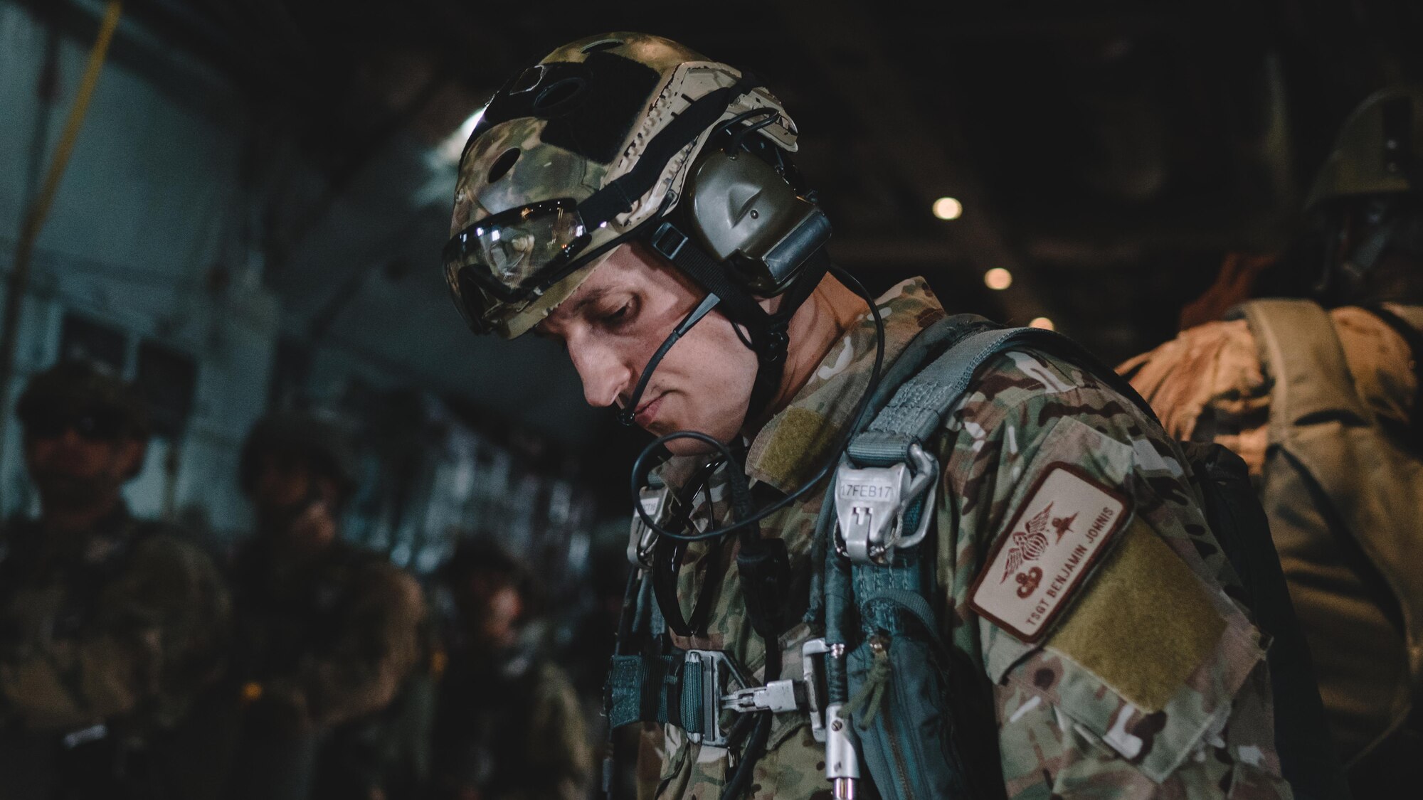 Soldiers from the 1st Battalion, 1st Special Operations Group (Airborne), prepare to conduct an airdrop jump demonstration from a C-130 Hercules over Yokota Air Base, Japan, during the Japanese-American Friendship Festival, Sept. 17, 2016. The jump displayed Yokota's airdrop capability to the festival attendees while also allowing the airborne members to receive scheduled training and update jump currency. (U.S. Air Force photo by Senior Airman Delano Scott/Released)