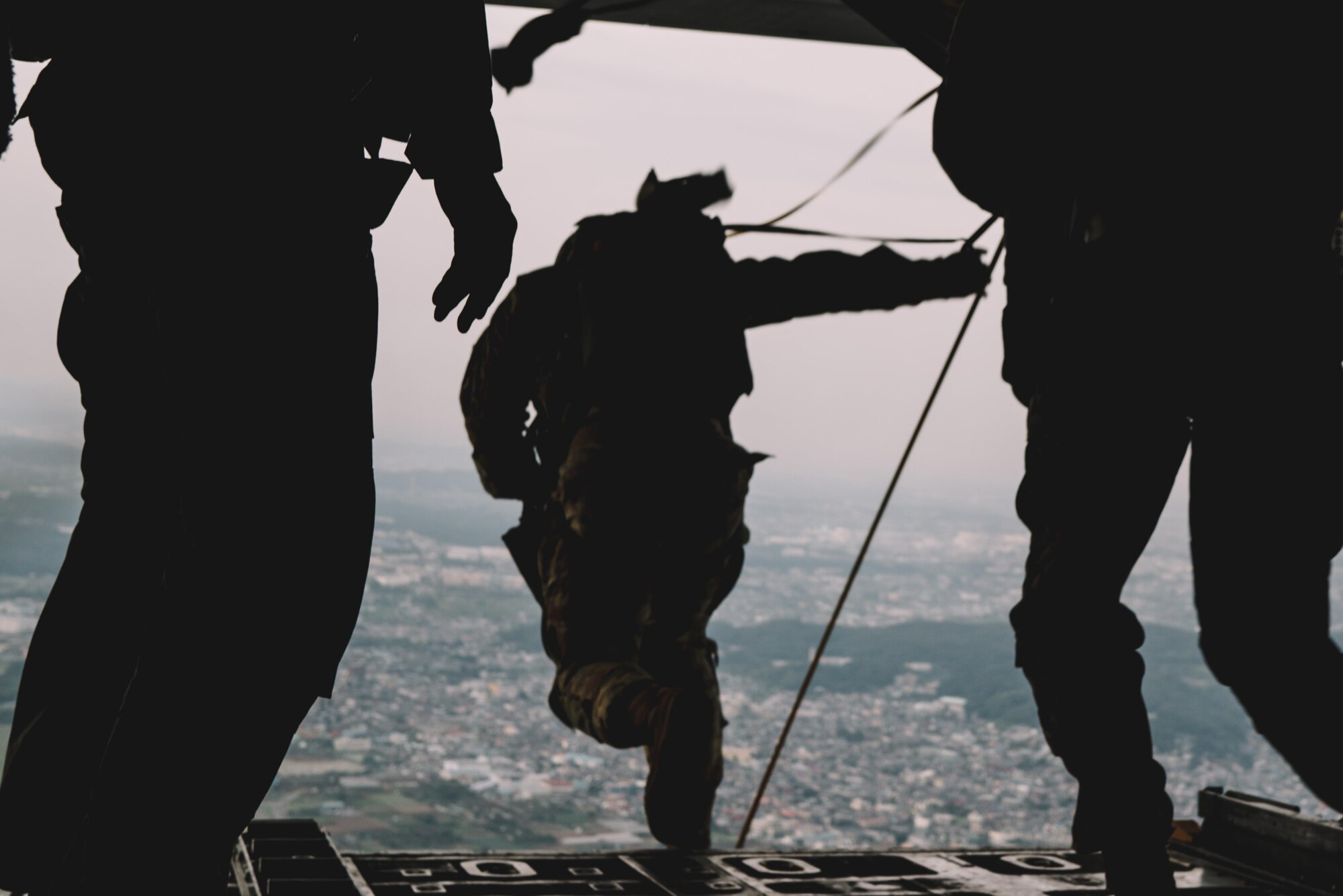 A soldier from the 1st Battalion, 1st Special Operations Group (Airborne), jumps from a C-130 Hercules over Yokota Air Base, Japan, during the Japanese-American Friendship Festival, Sept. 17, 2016. The demonstration was one of many events during the weekend that showcased U.S. military capabilities. (U.S. Air Force photo by Senior Airman Delano Scott/Released)