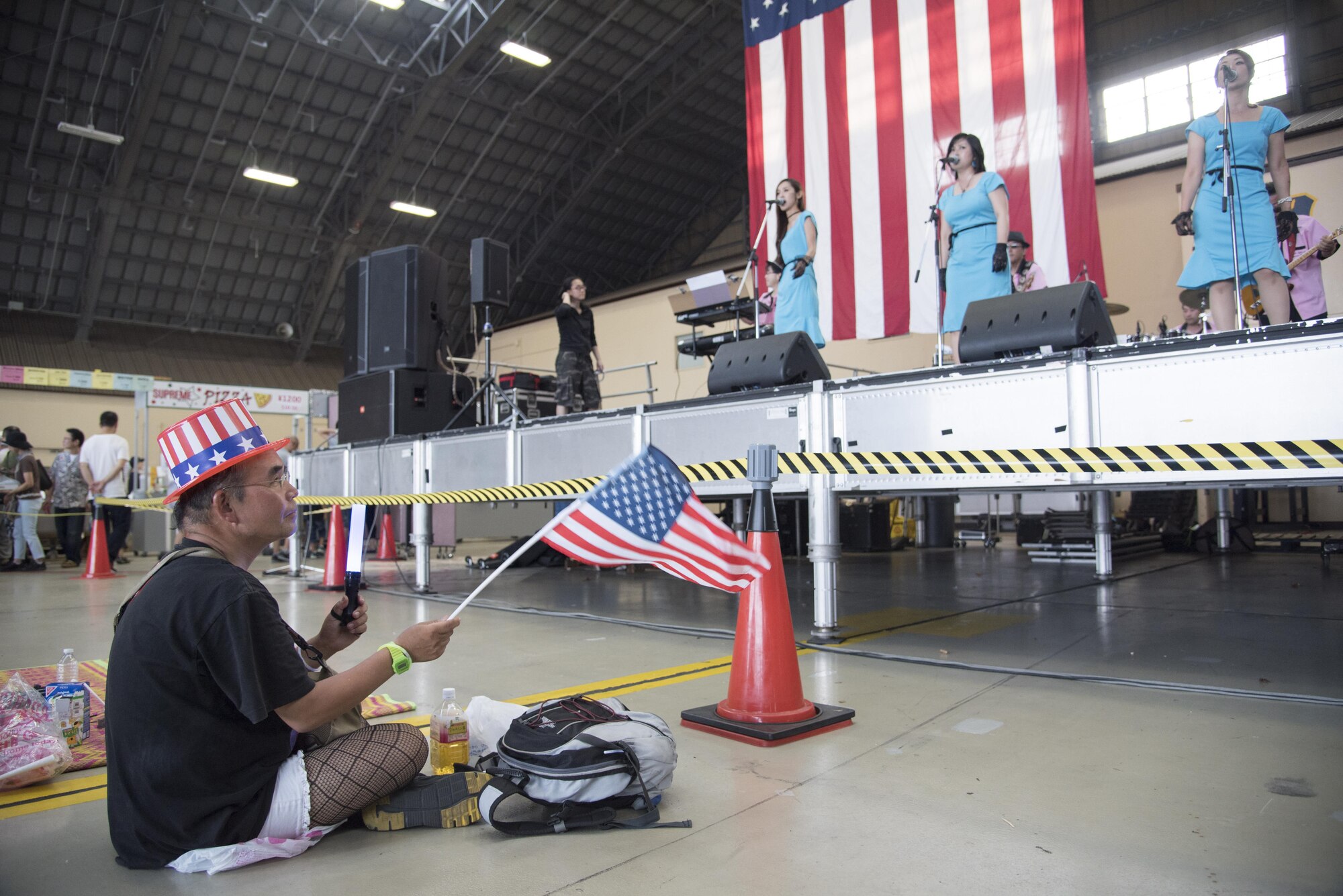 A Japanese man waves an American flag as he watches a musical performance during the 2016 Friendship Festival Sept. 17, 2016 at Yokota Air Base, Japan. The Friendship Festival is a two-day event where Yokota opens its gates to our Japanese neighbors. In 2015, more than 185,000 people visited Yokota during the Friendship Festival. (U.S. Air Force photo by Staff Sgt. Michael Washburn/Released)