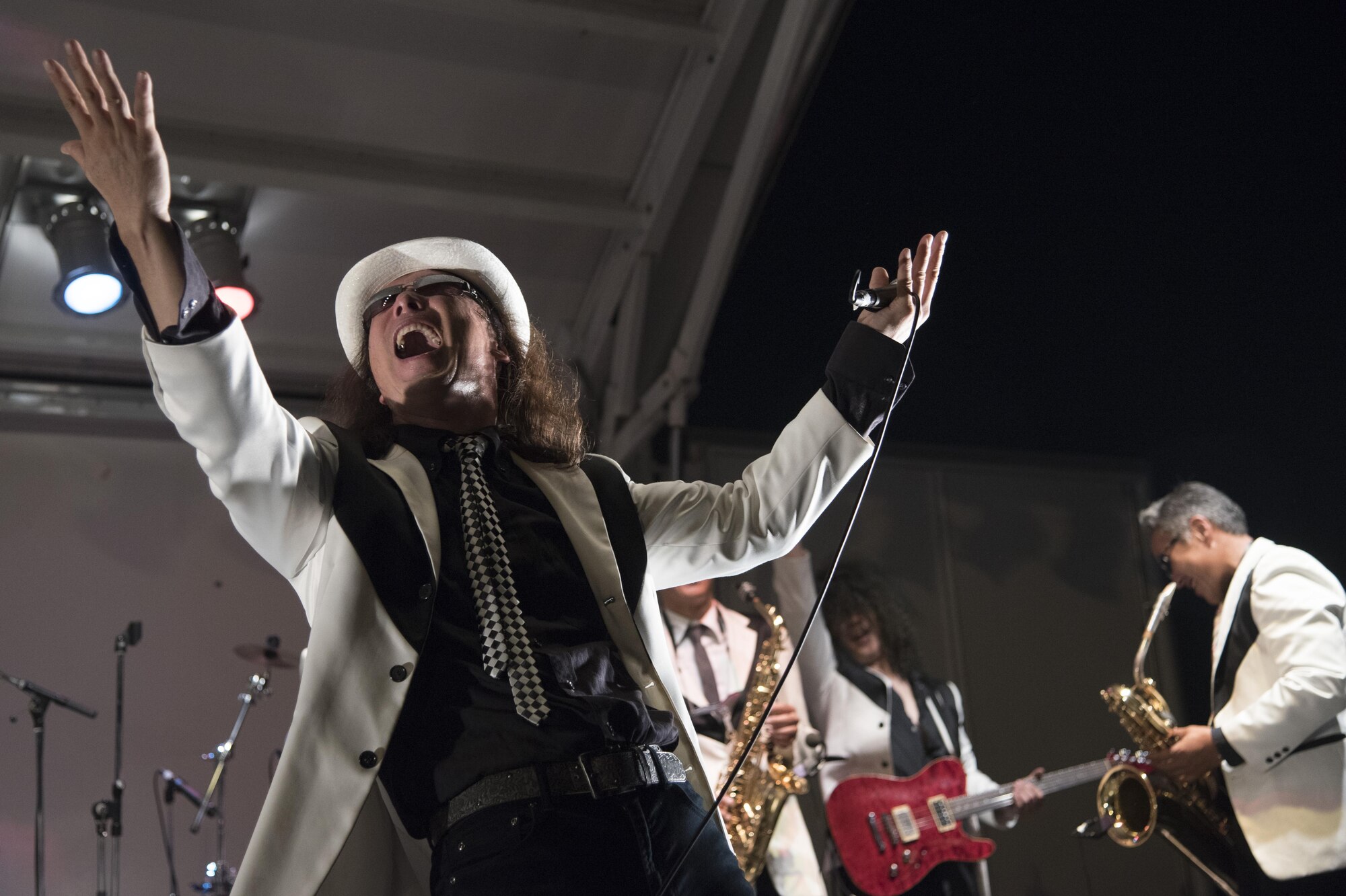 The lead singer of the ska band Eskalators sings to the crowd during the 2016 Friendship Festival at Yokota Air Base, Japan, Sept. 17, 2016. The two-day long festival is a chance to increase the bilateral relationship between the U.S. and Japan. (U.S. Air Force photo by Staff Sgt. Michael Washburn/Released)