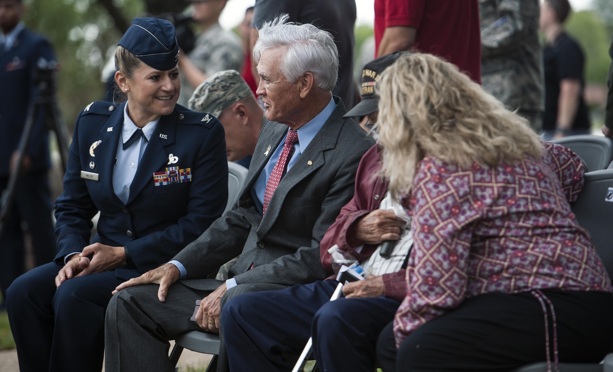 Col. Caroline M. Miller, 633rd Air Base Wing commander, shares a laugh with U.S. Air Force Lt. Col. (Ret.) Barry Bridger, former 43rd Tactical Fighter Squadron F-4 Phantom aircraft commander, during a POW/MIA closing ceremony at Joint Base Langley-Eustis, Va., Sept. 16, 2016. Bridger was shot down, captured and imprisoned for 2,232 days (six years) during the Vietnam War. The third Friday in September has been observed as POW/MIA Recognition Day since 1986. Since World War I, more than 150,000 Americans have been held as prisoners of war and more than 83,400 service members are still unaccounted for. (U.S. Air Force photo by Staff Sgt. Nick Wilson)