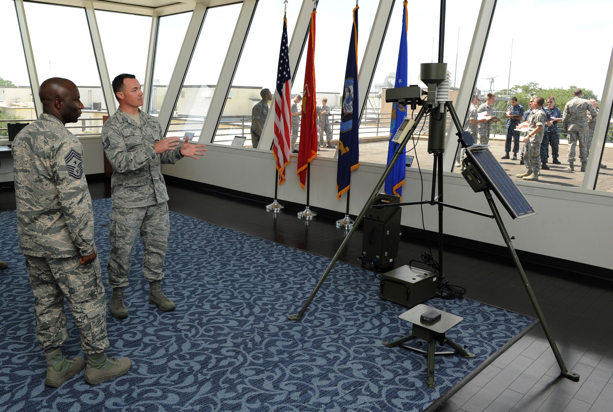 Chief Master Sgt. Vegas Clark, 81st Training Wing command chief, receives a briefing from Tech. Sgt. Dominick Martin, 335th Training Squadron advanced weather management course instructor, at the weather training complex observatory during an immersion tour Sept. 12, 2016, on Keesler Air Force Base, Miss.  The purpose of the tour was to become familiar with the 81st Training Group’s mission, operations and personnel. (U.S. Air Force photo by Kemberly Groue/Released)